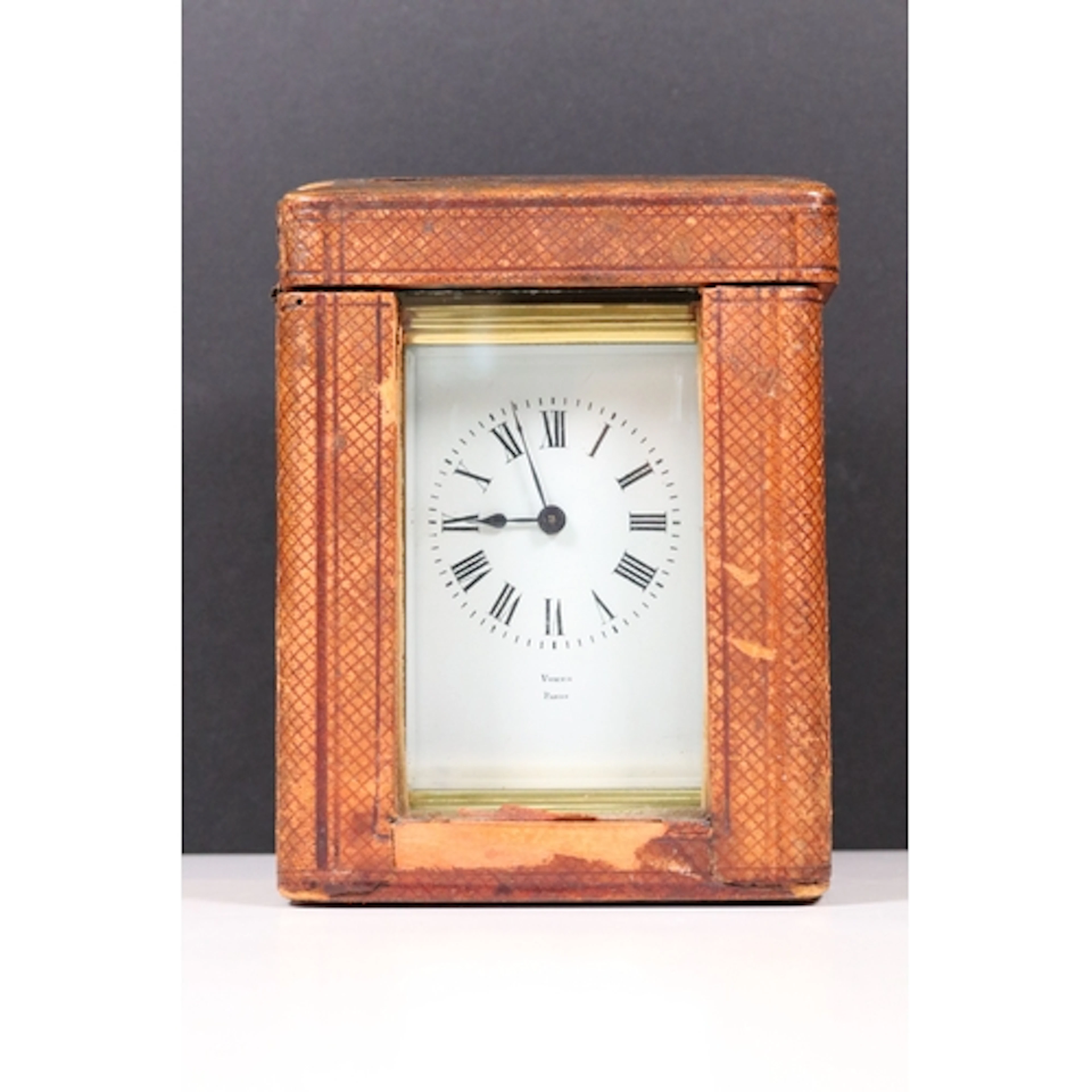 Leather cased French brass carriage clock with four bevelled...
