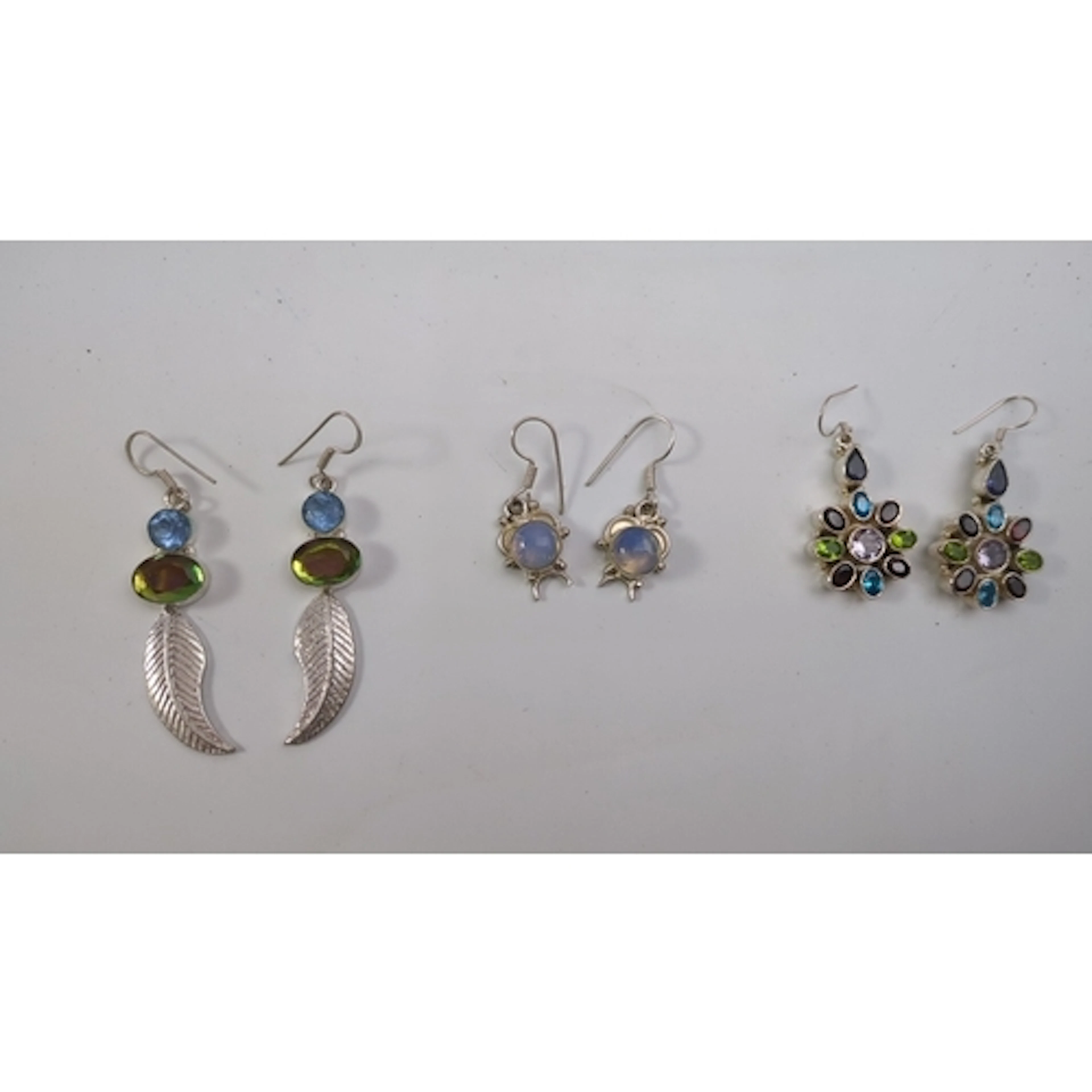 A group of three pairs of sterling silver drop earrings, inc...