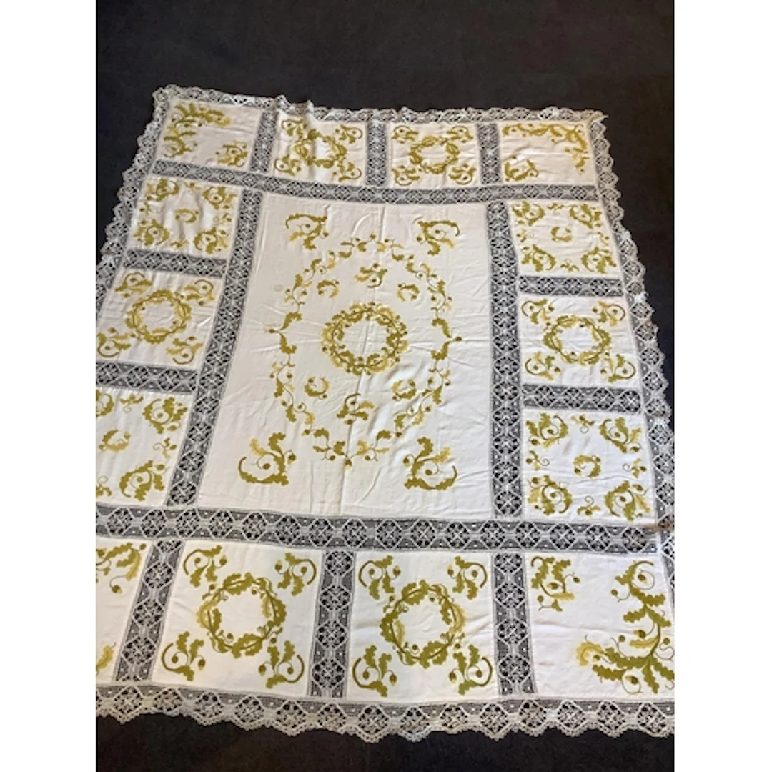 A early 20th century linen bedcover, decorated in the Arts a...