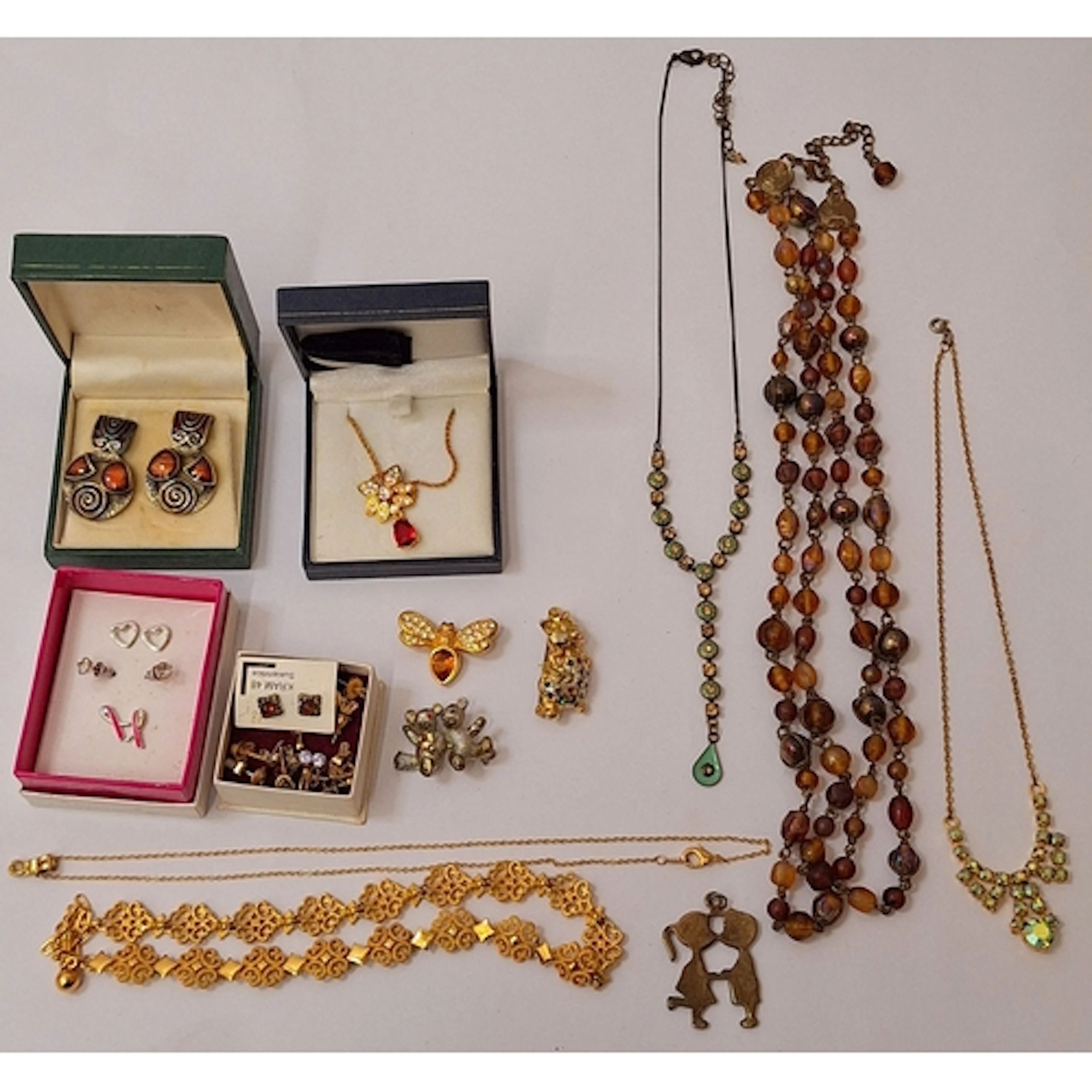 Contemporary costume jewellery, inc. gold tone filigree pane...
