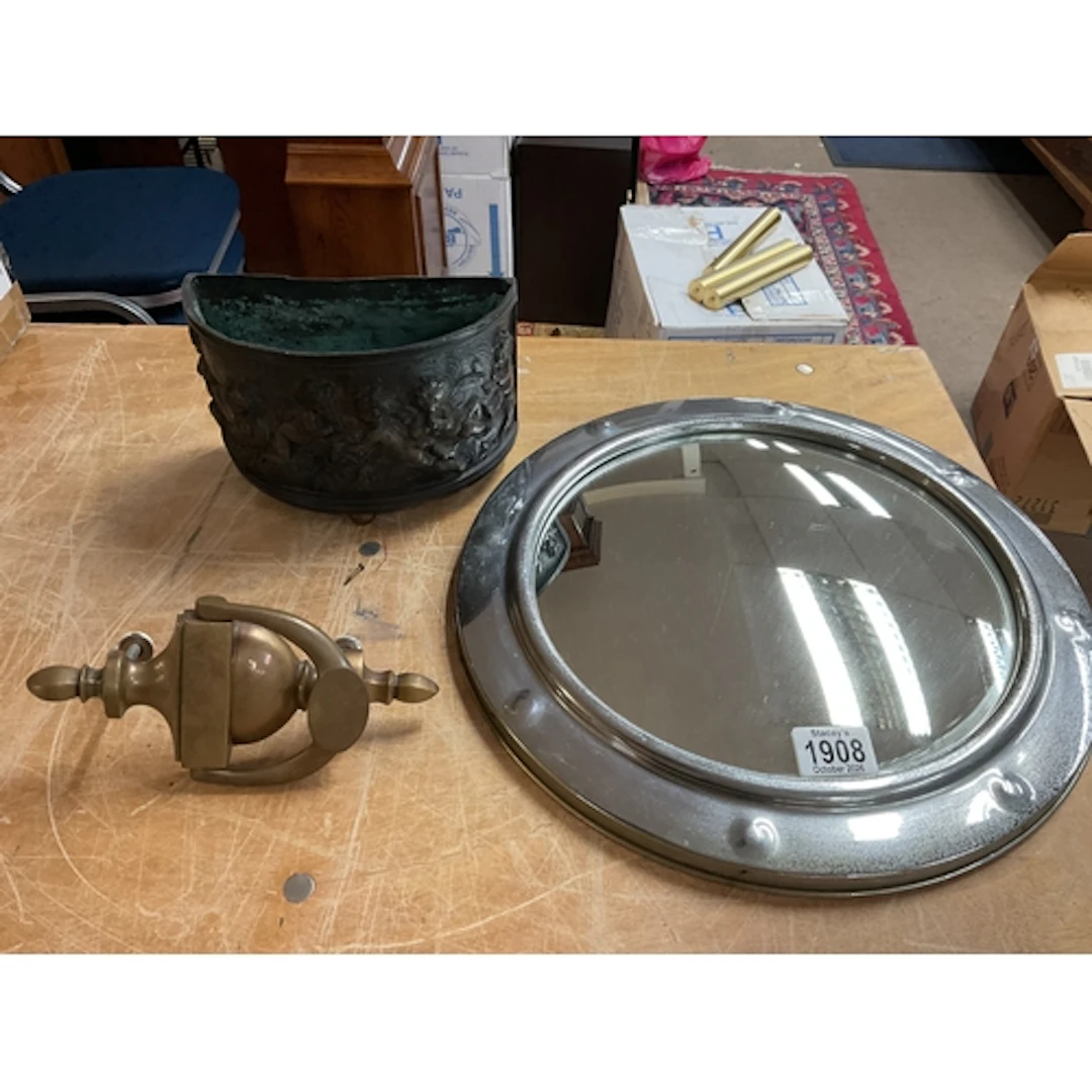 Bronze cherub planter, brass door knocker and chrome mirror.