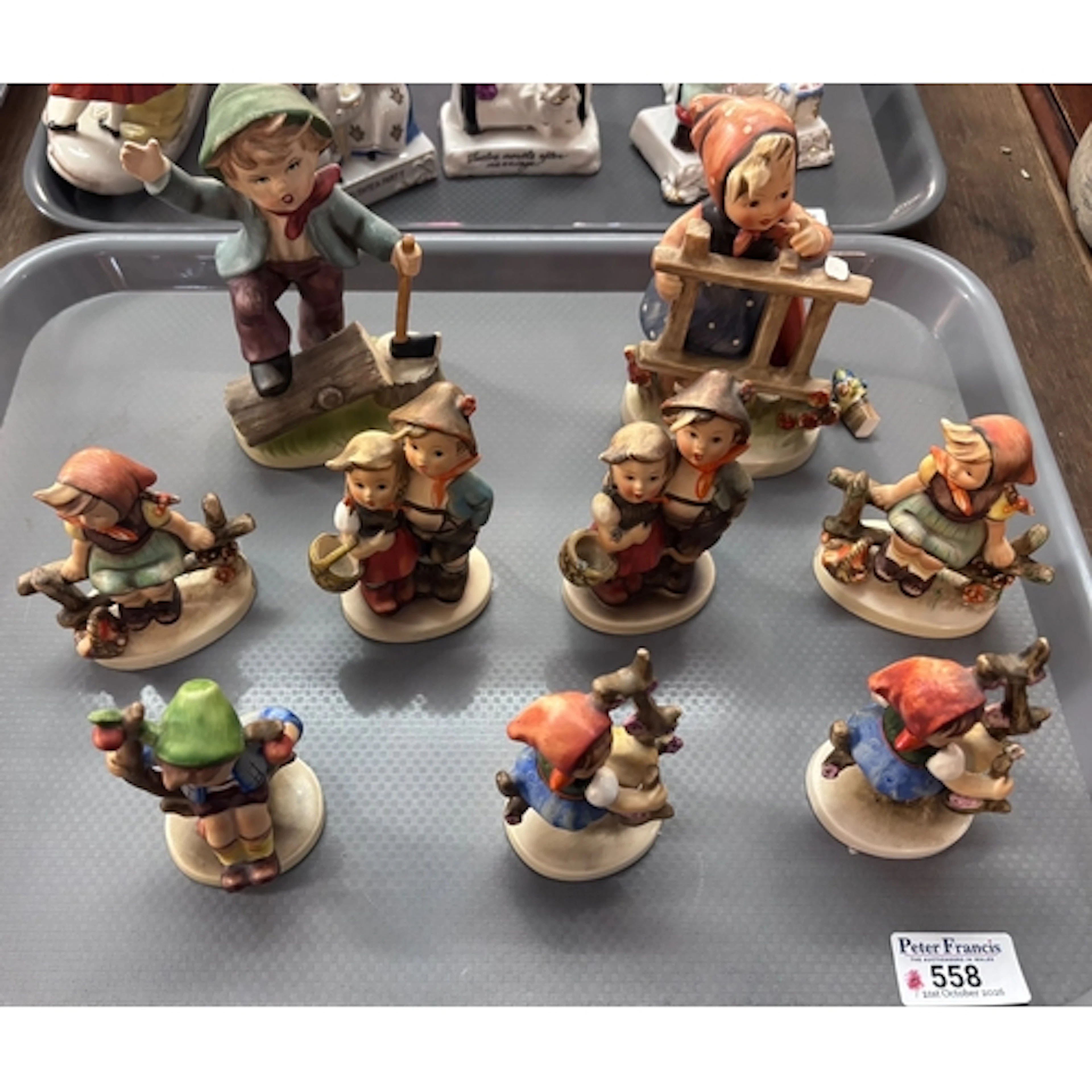 Tray of nine Hummel and Hummel style figurines and figure gr...
