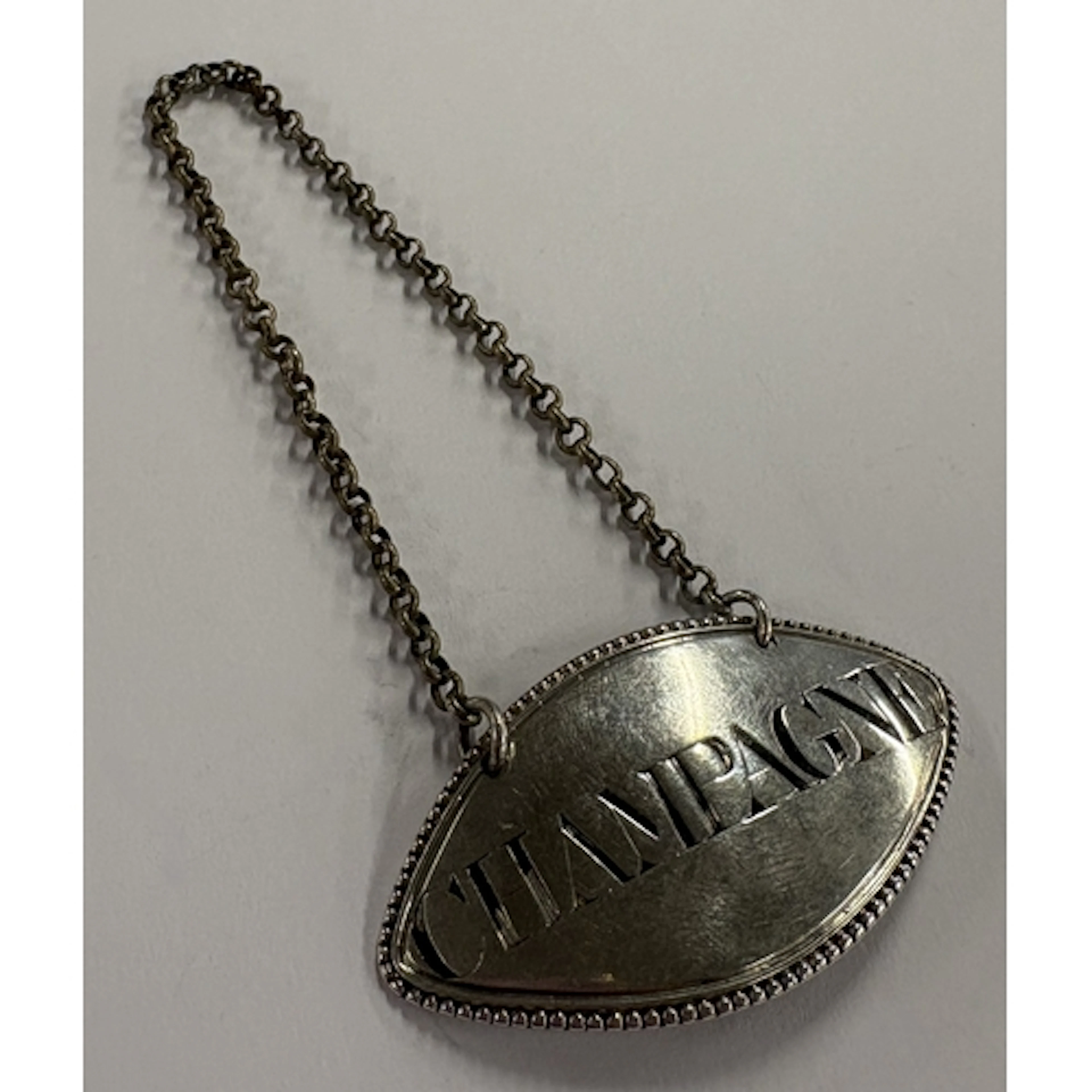 An 18th Century silver wine label for 'Champagne', maker's a...