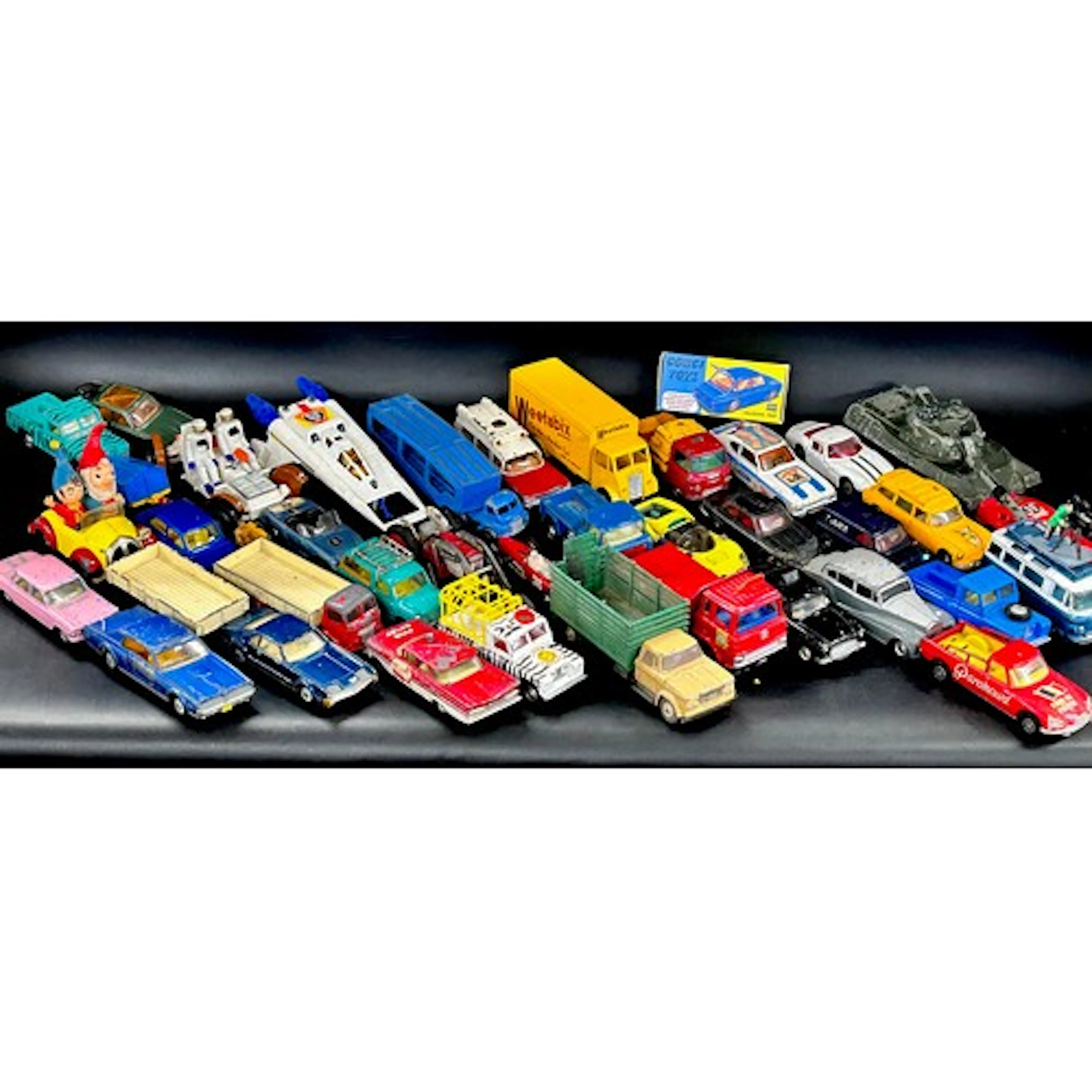 A collection of die-cast model vehicles, including Corgi and...