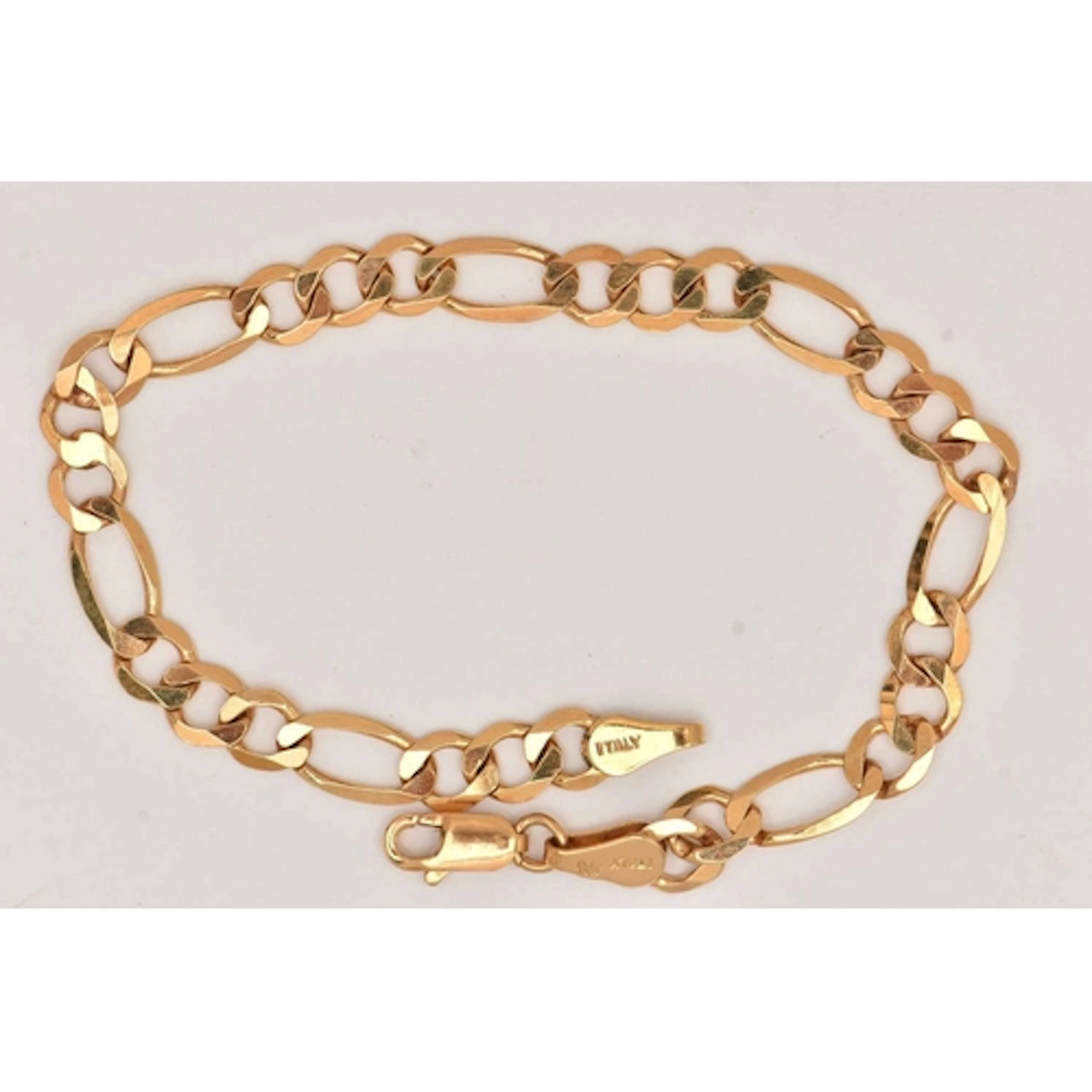 A 9CT GOLD FIGARO CHAIN BRACELET, fitted with a lobster clas...