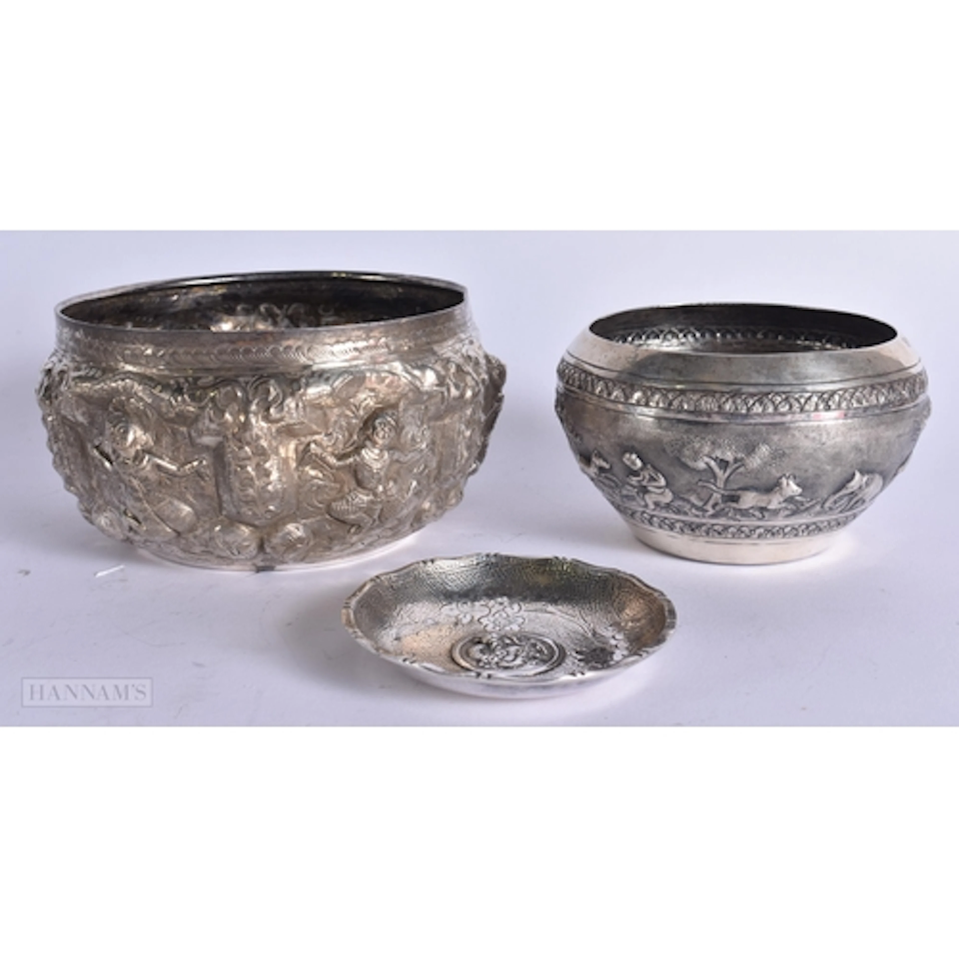 TWO ANTIQUE EASTERN WHITE METAL BOWLS and a dragon dish. 299...