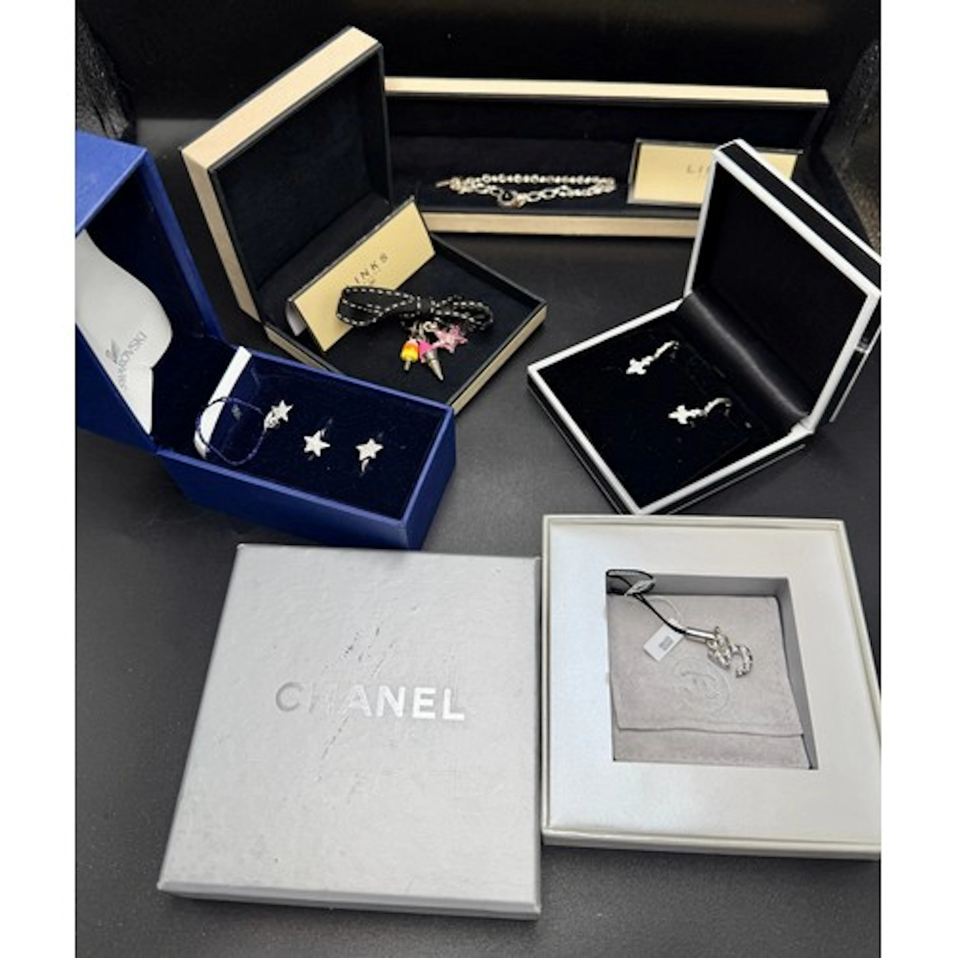 Vintage jewellery to include Chanel 5 silver charm, Links of...