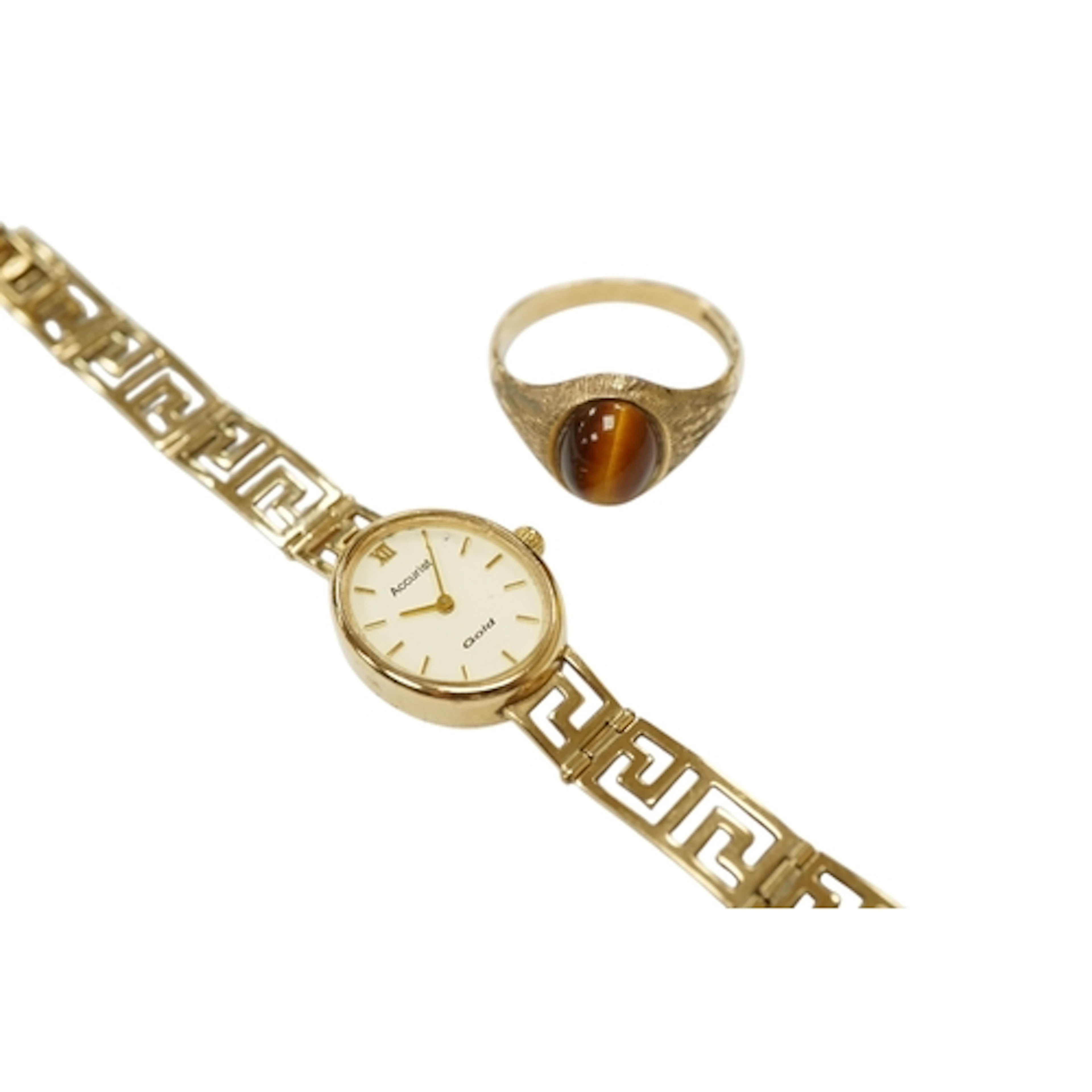 A 1970's 9ct gold and single stone tiger's eye quartz ring, ...