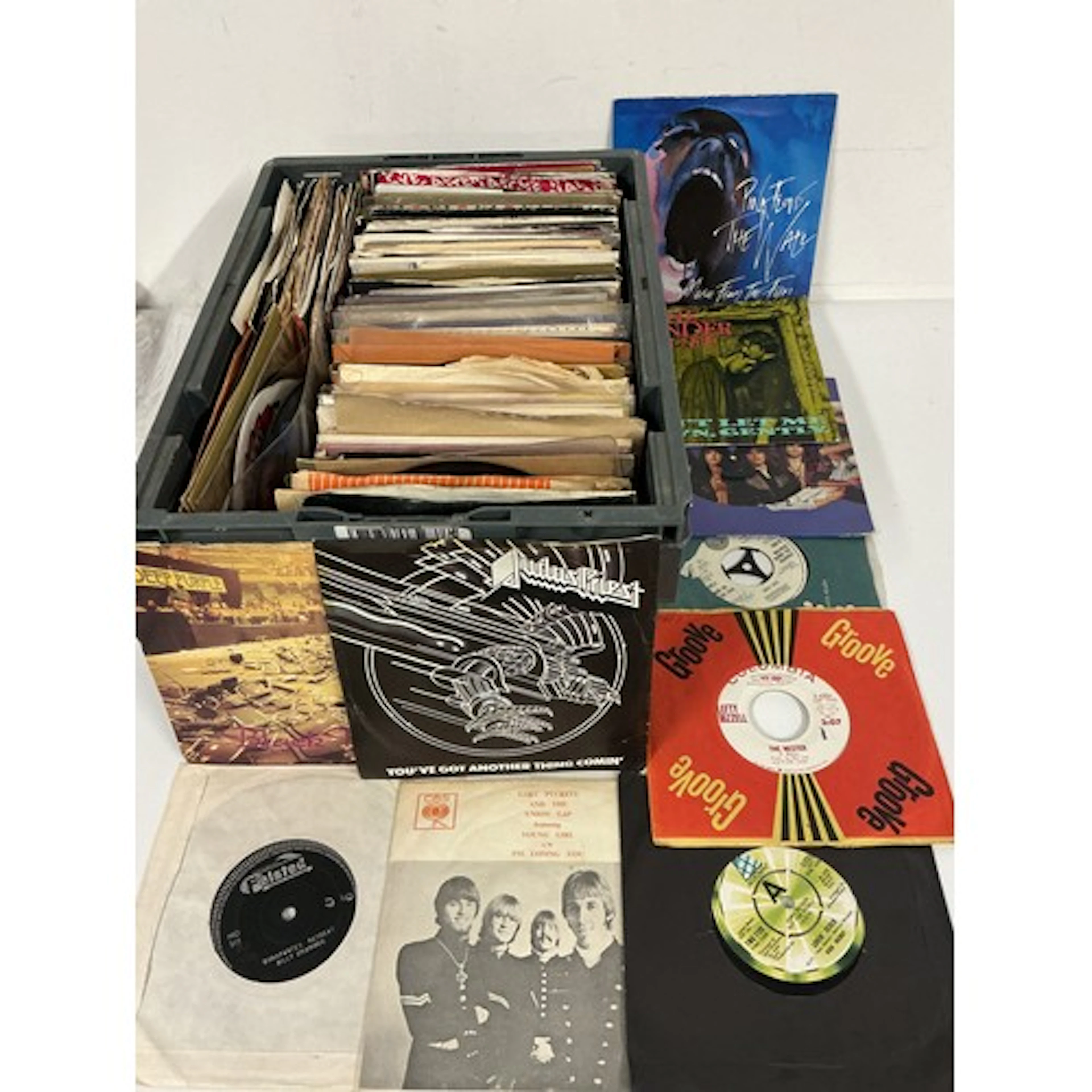 Two records cases of 7” singles by various artists including...
