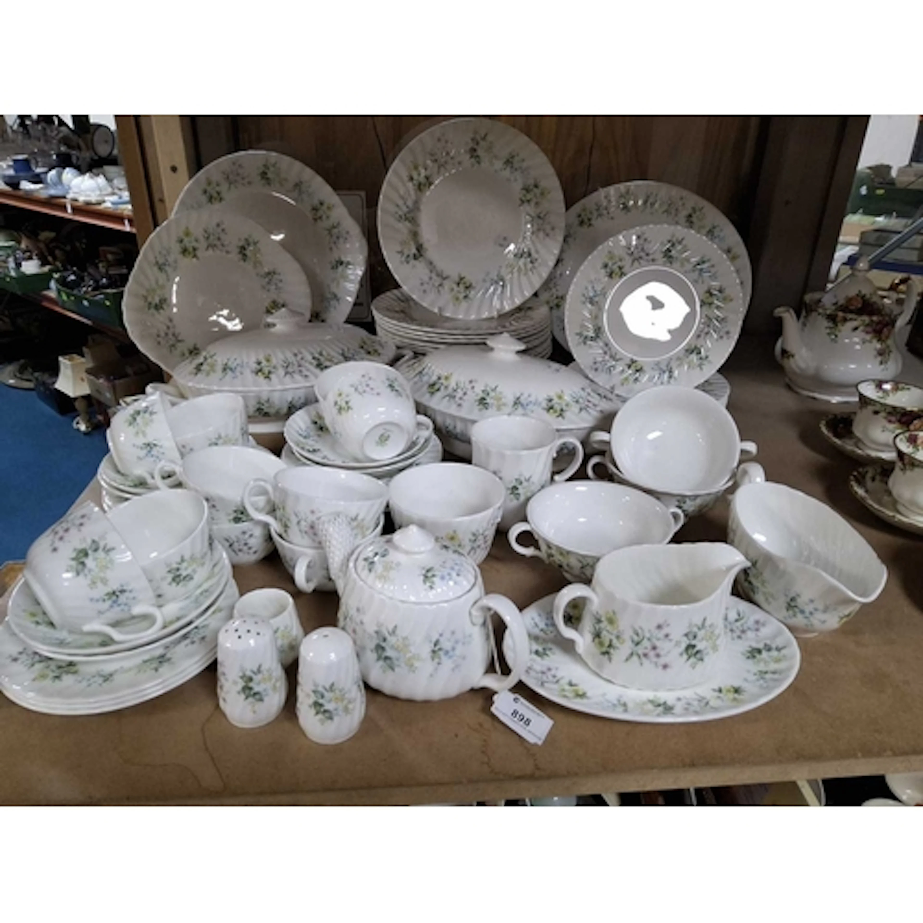 A 'SPRING VALLEY' PATTERN DINNER SERVICE BY MINTON comprisin...