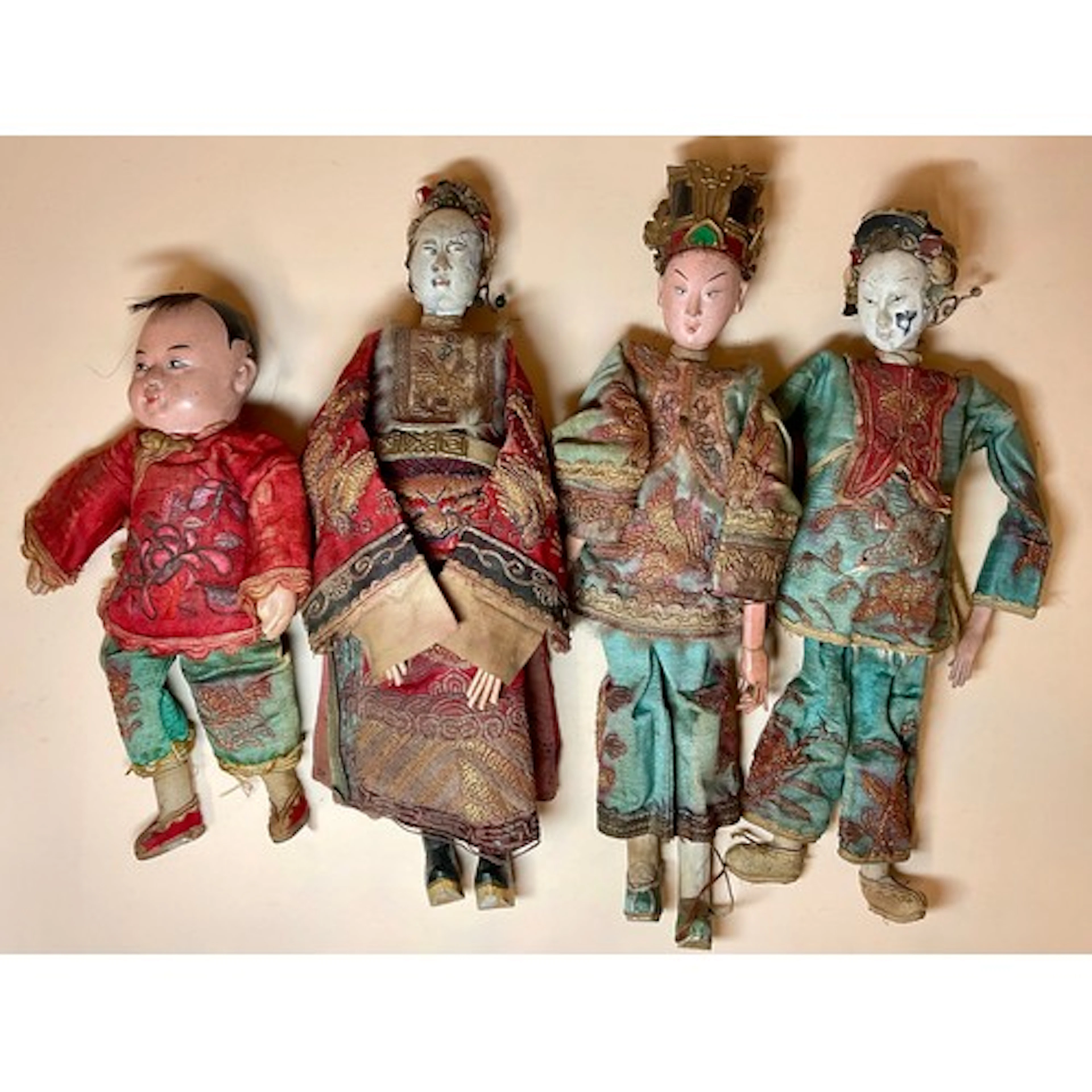 A 19th century Chinese doll, painted wooden head and limbs, ...