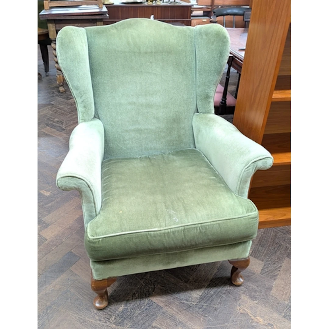 Vintage Parker Knoll green upholstered wing back armchair