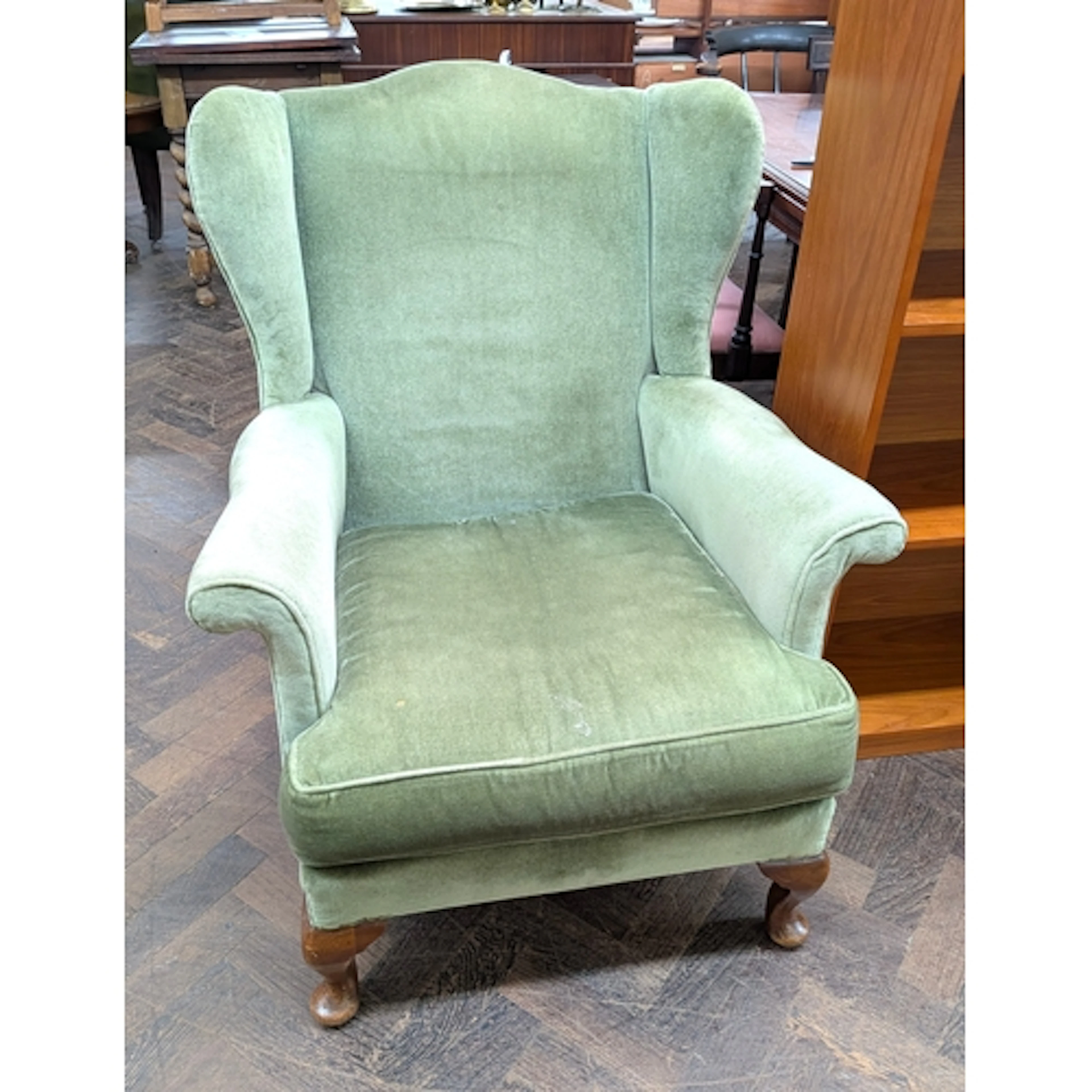Vintage Parker Knoll green upholstered wing back armchair