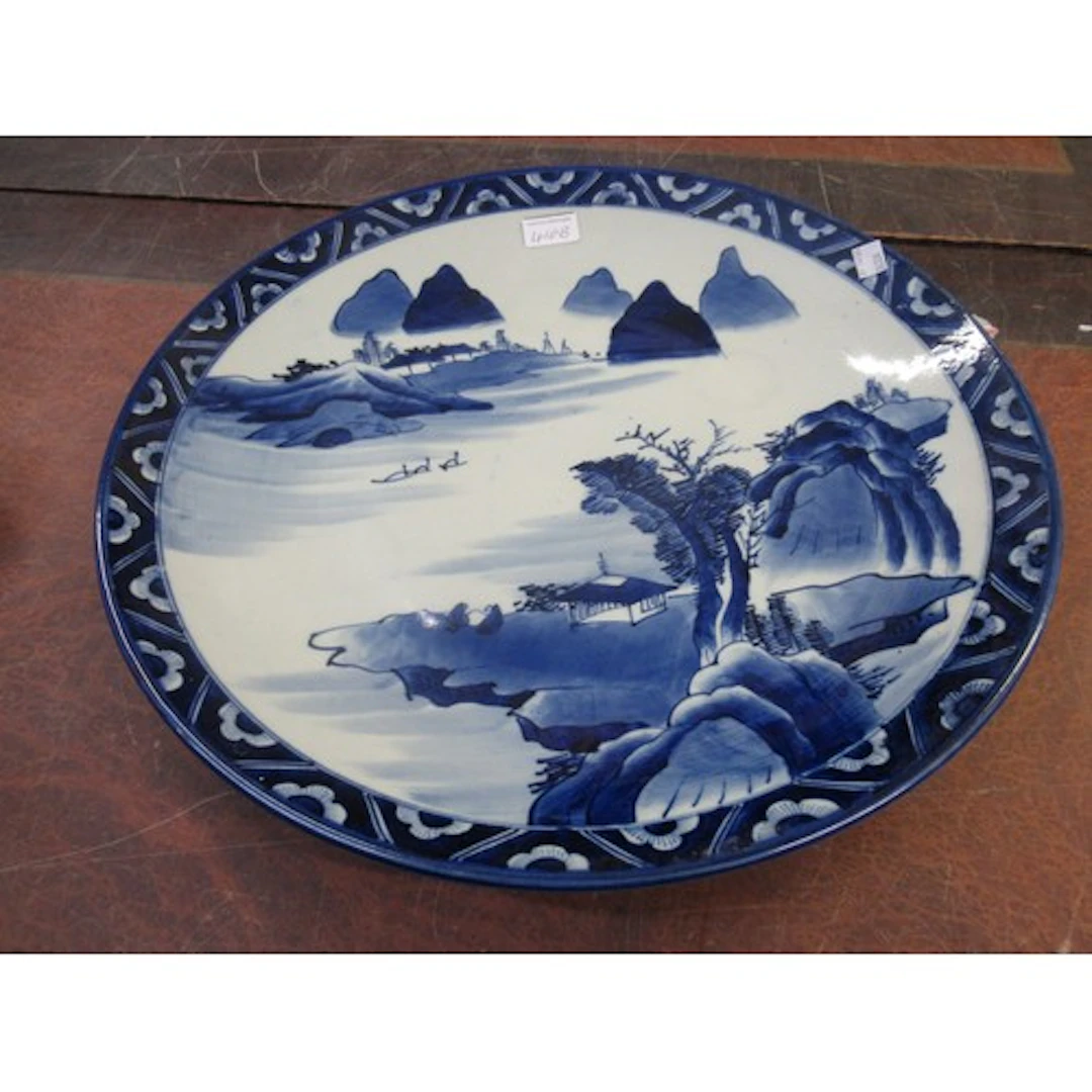 Japanese circular blue and white wall charger, decorated wit...