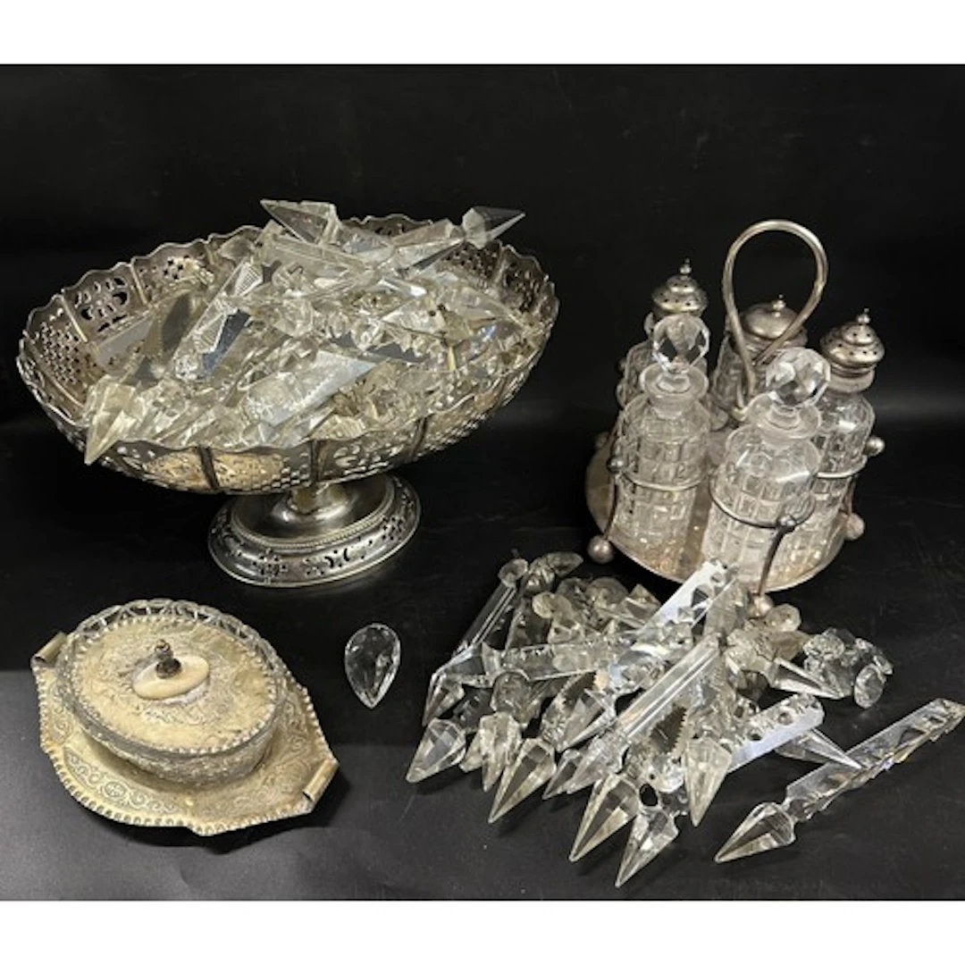 A collection of glass and silver plated items to include a c...