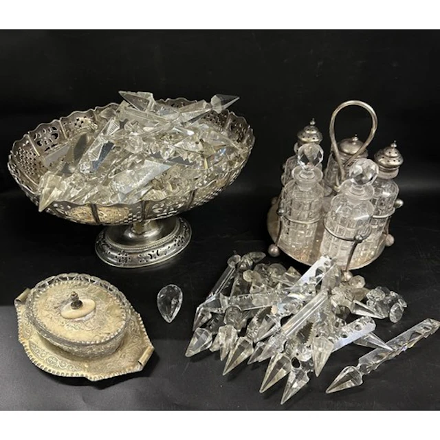 A collection of glass and silver plated items to include a c...