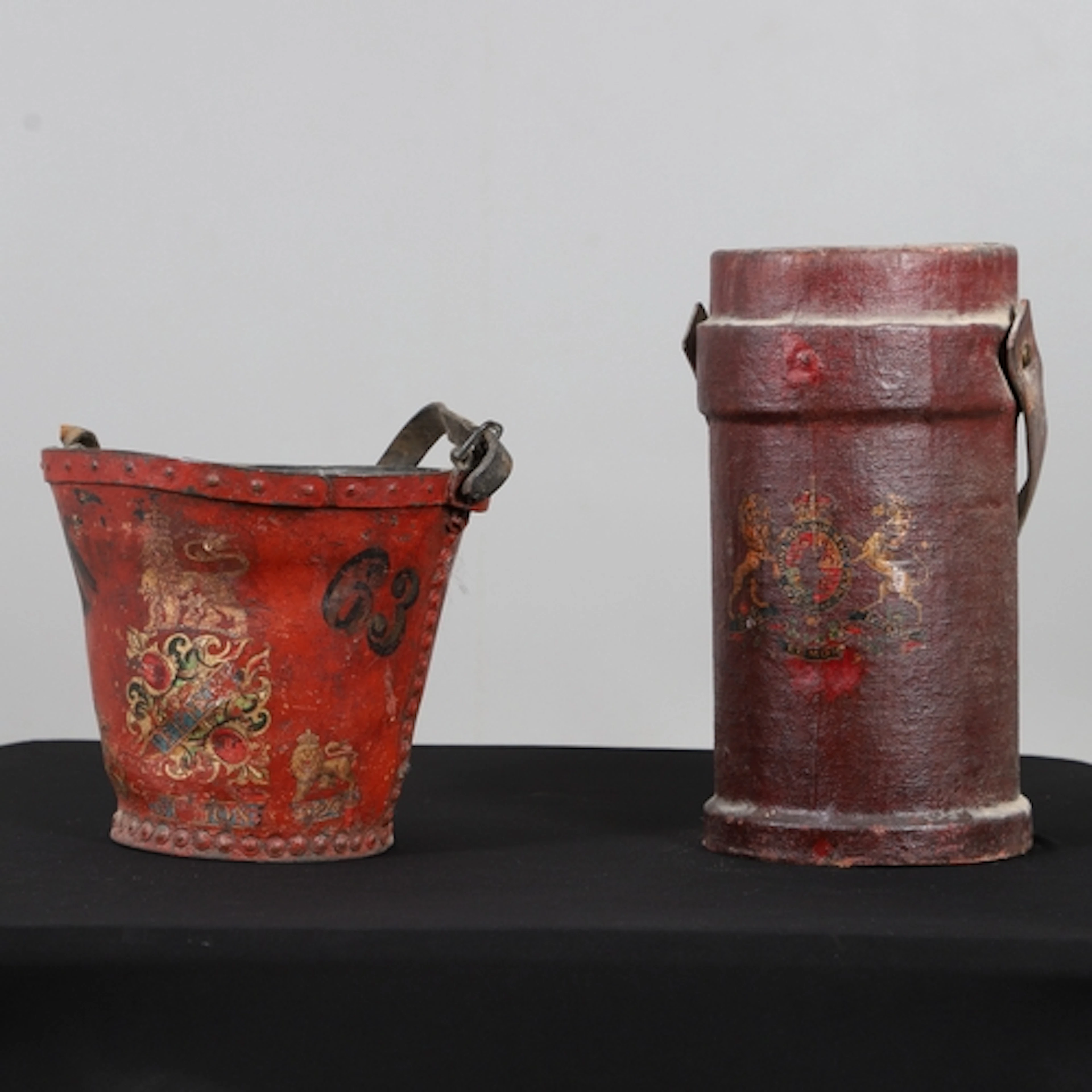 A 19TH CENTURY LEATHER FIRE BUCKET AND A LEATHER SHOT CARRIE...