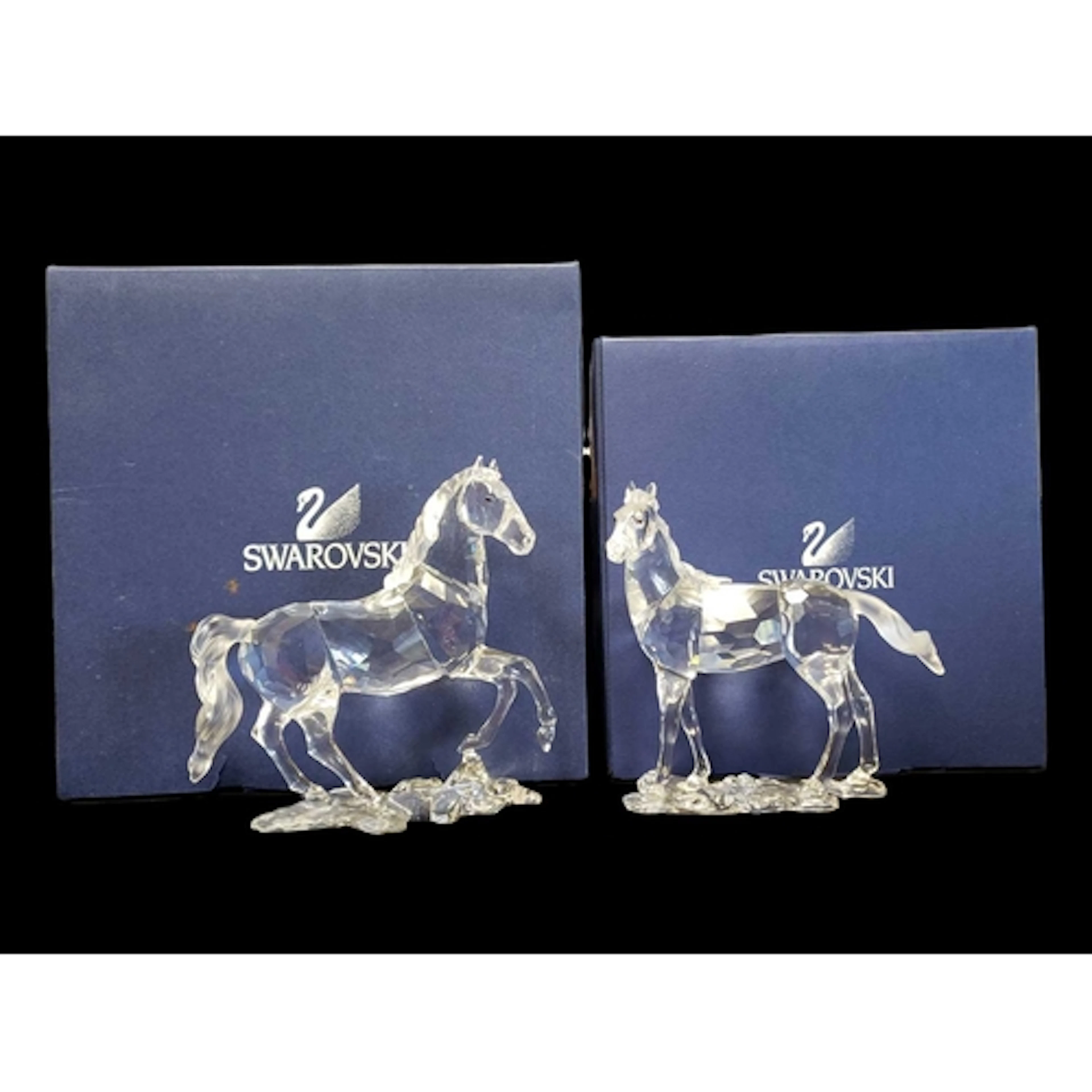 Swarovski - Two 21st century boxed crystal glass horse figur...