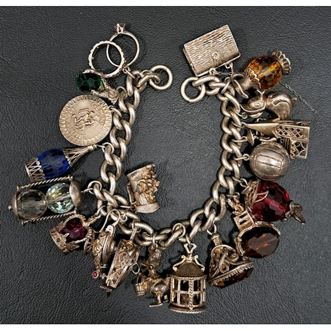 HEAVY SILVER CHARM BRACELET the curb link bracelet with a go...