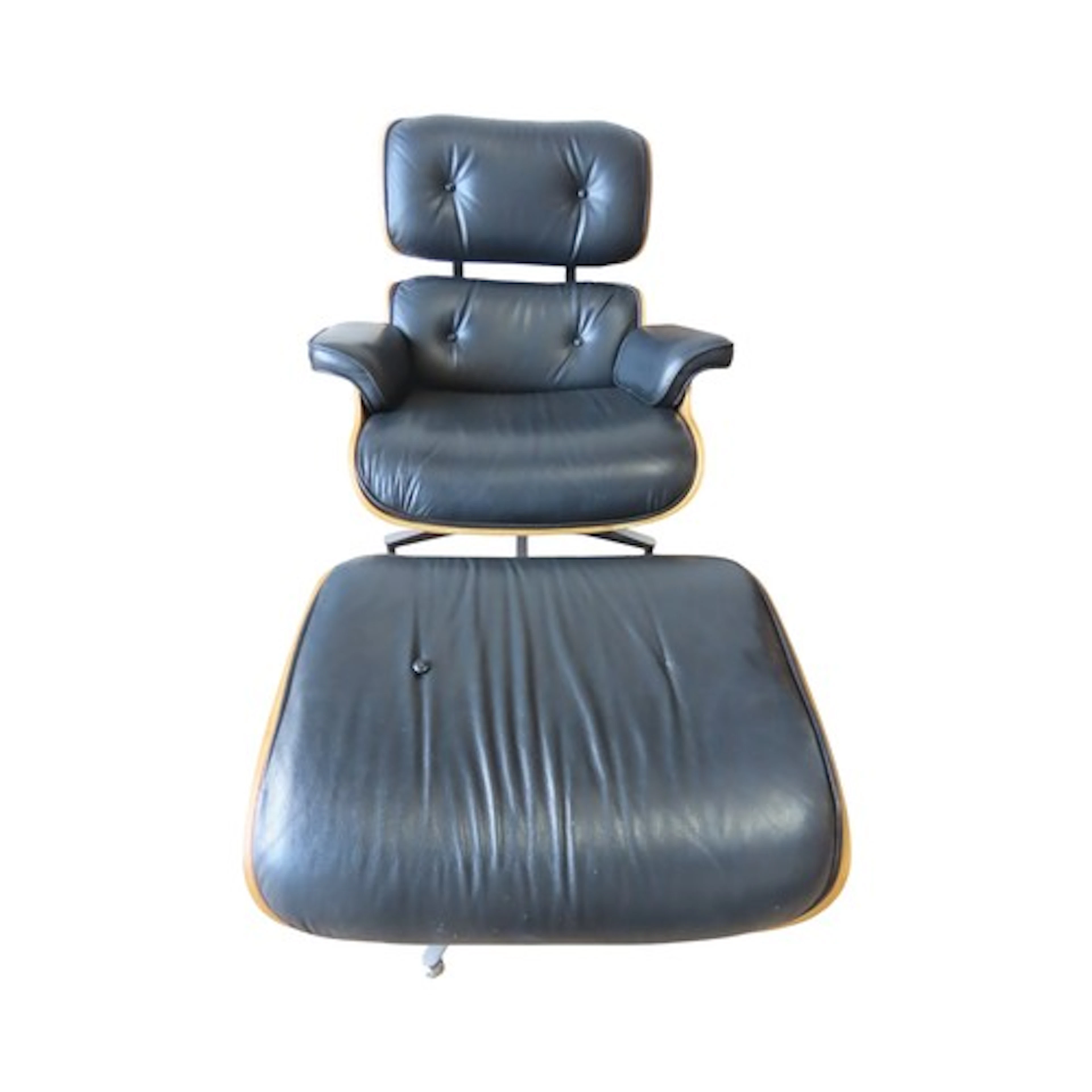 A classic Eames style swivel lounge chair and matching stool