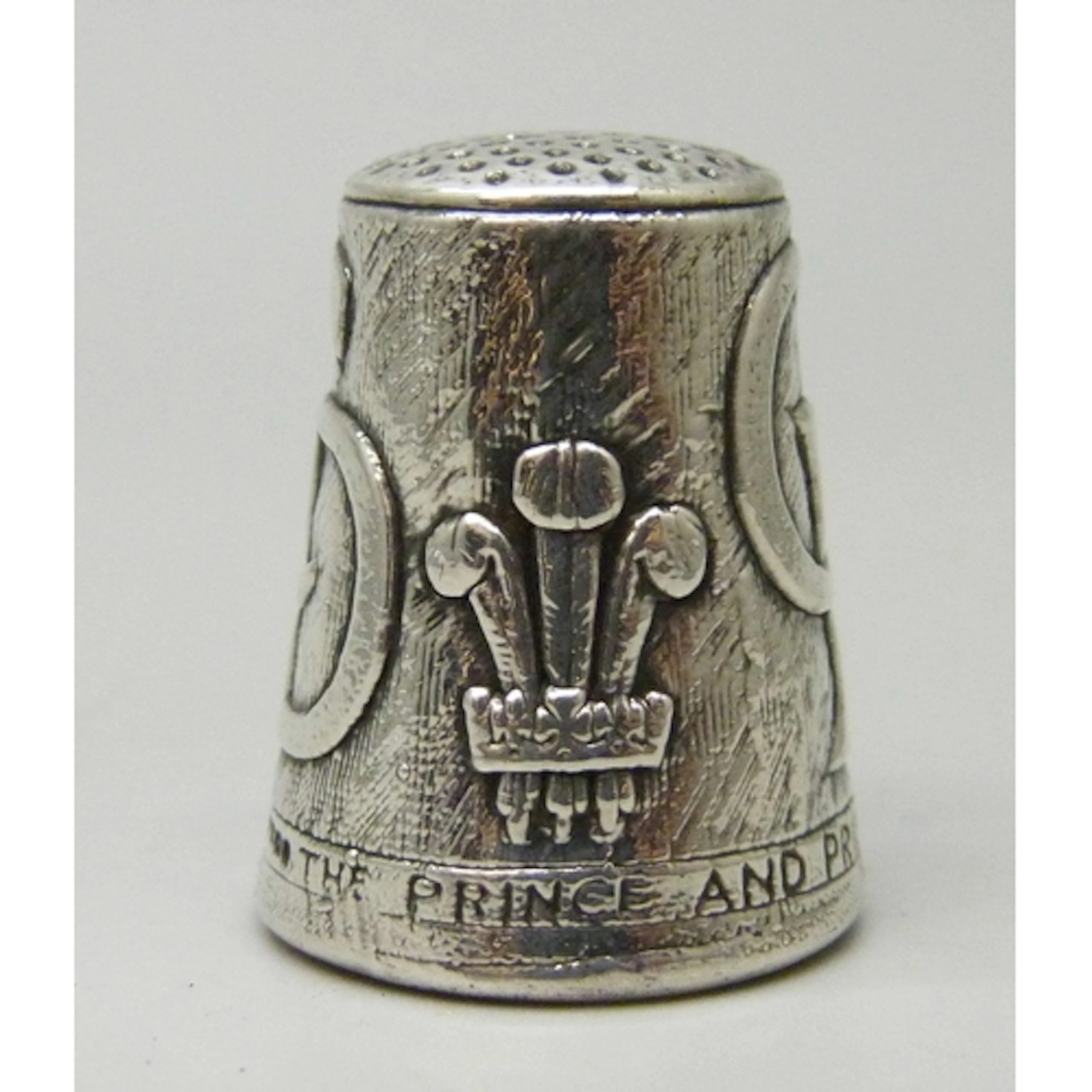 A Prince Charles and Princess Diana commemorative silver thi...