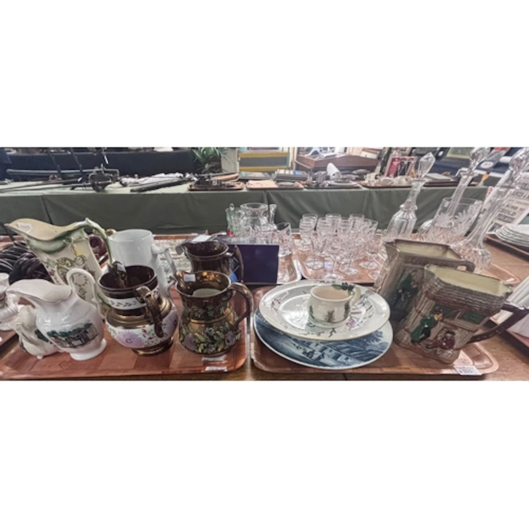Two trays of ceramics to include copper lustre dresser jugs,...