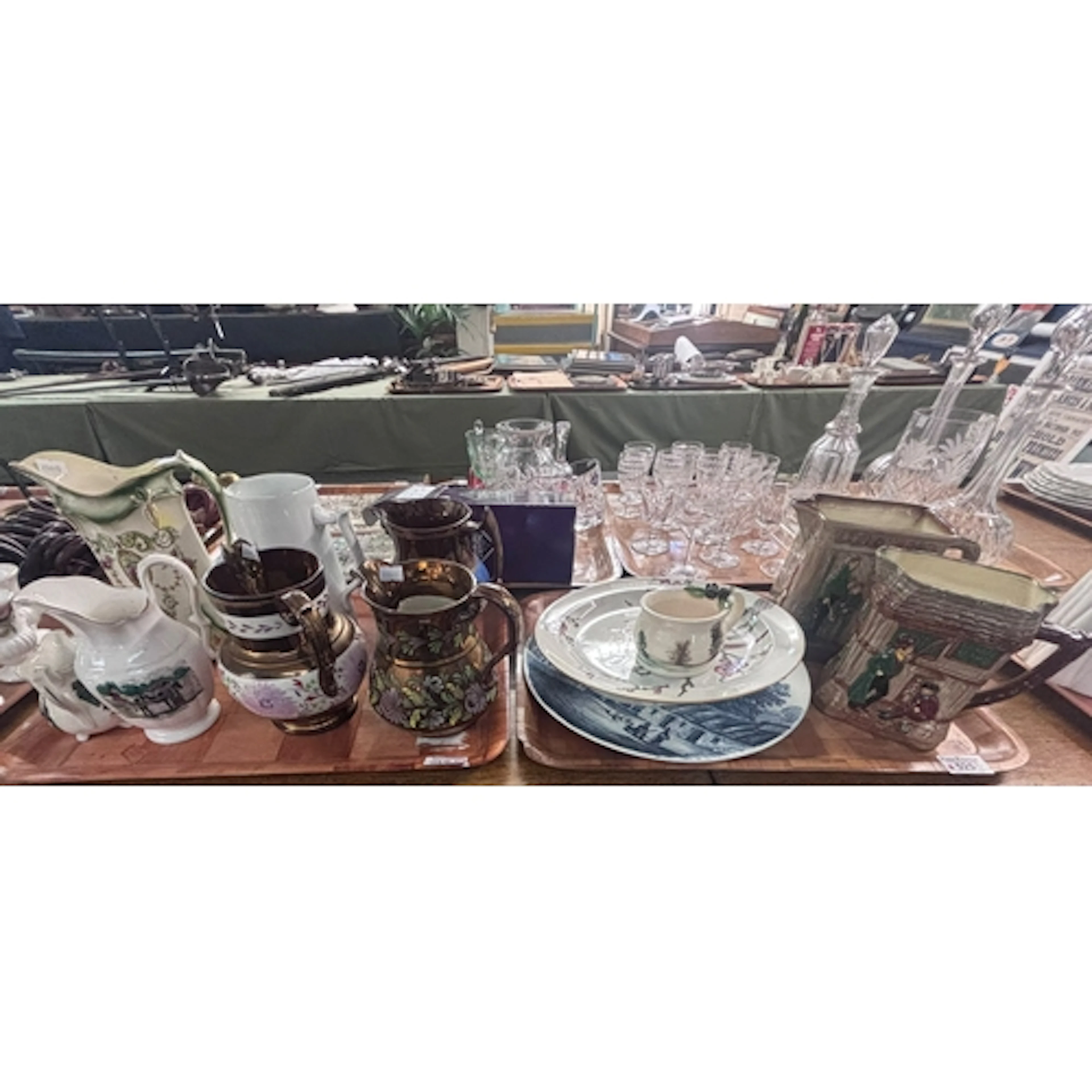 Two trays of ceramics to include copper lustre dresser jugs,...