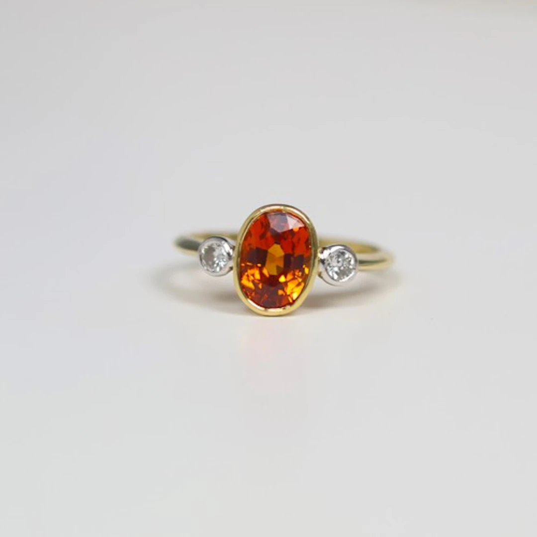 A late 20th century synthetic sapphire and diamond three sto...