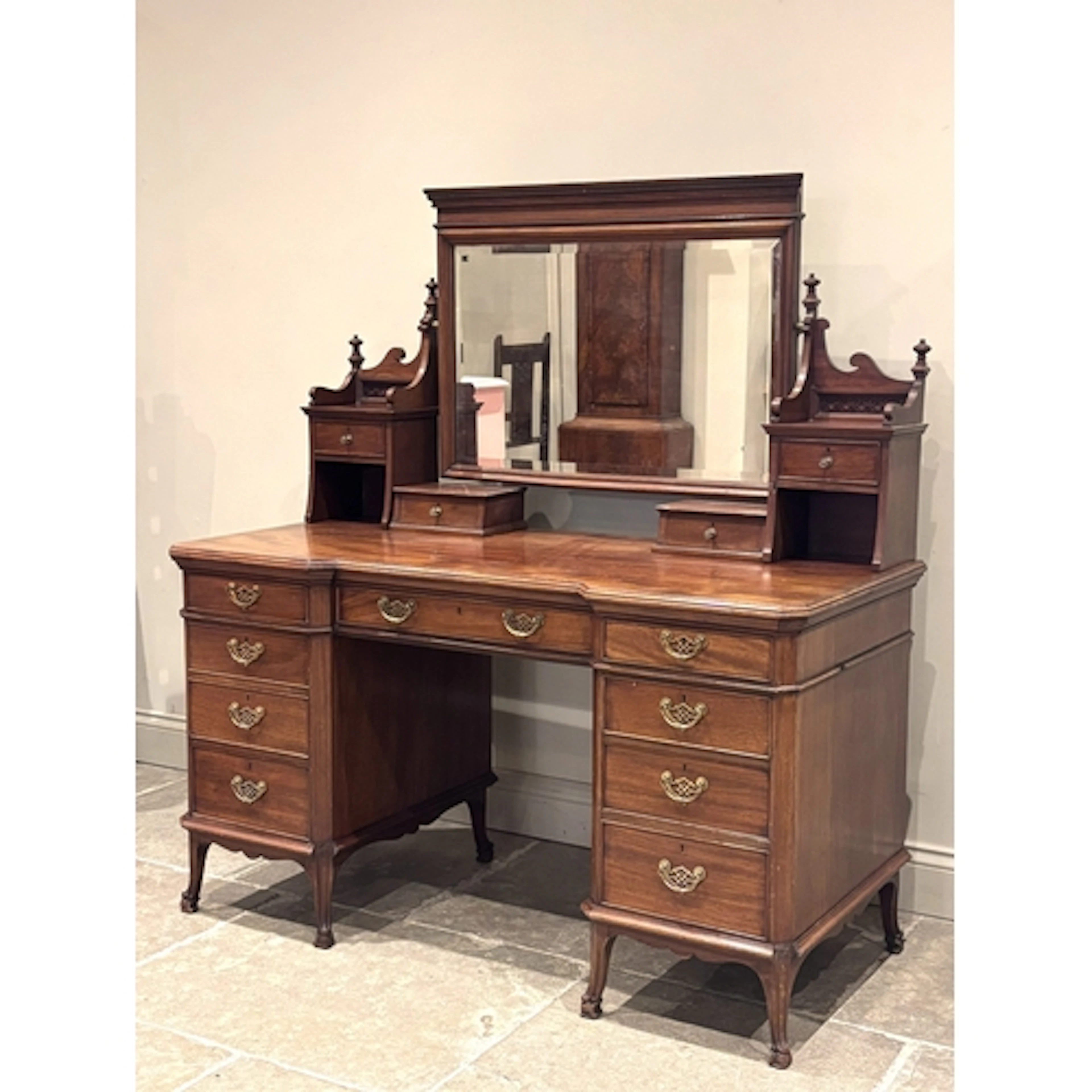 An Edwardian mahogany dressing table in the manner of Chippe...