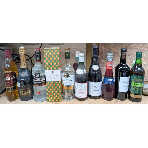A collection of twelve assorted bottles of wines and spirits...