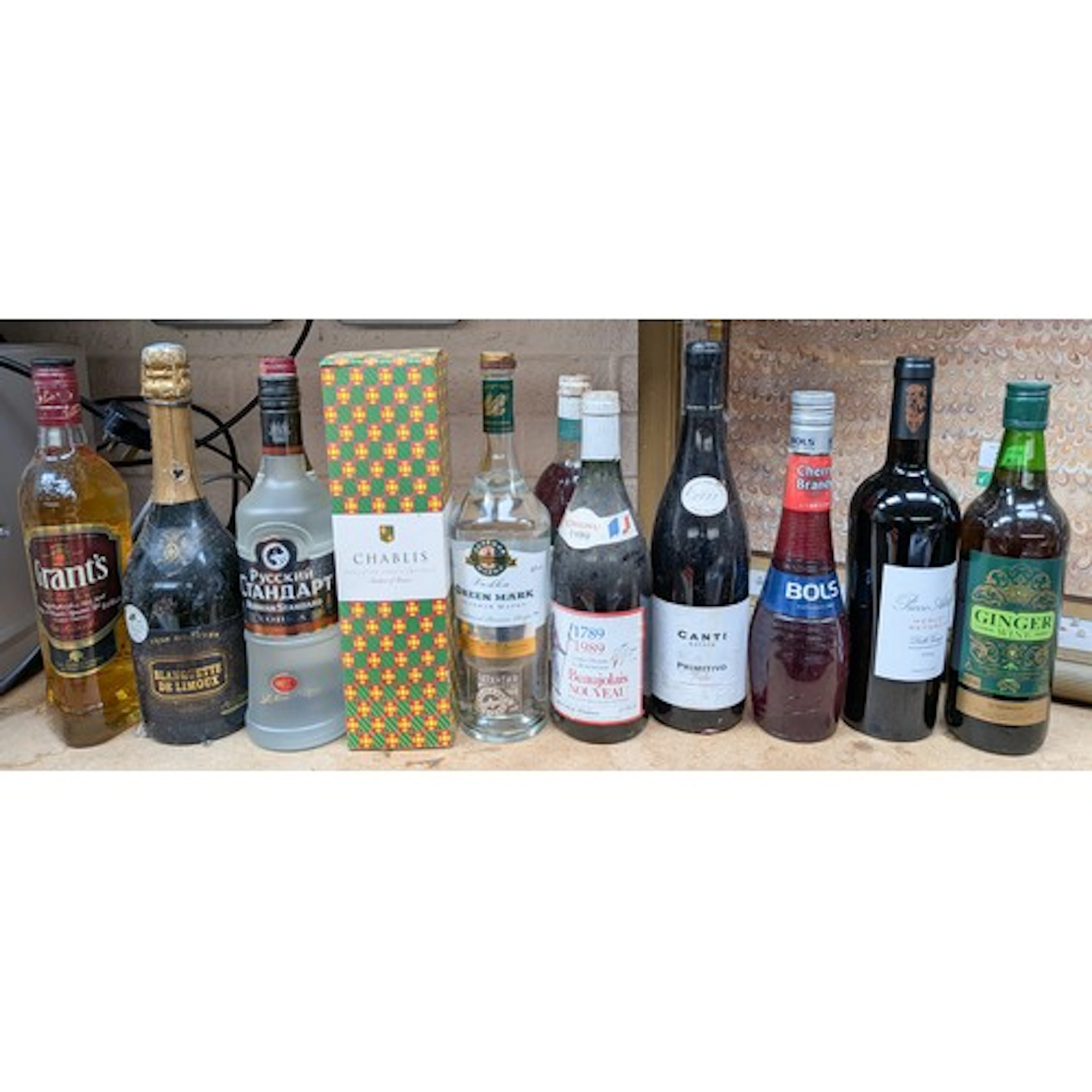 A collection of twelve assorted bottles of wines and spirits...
