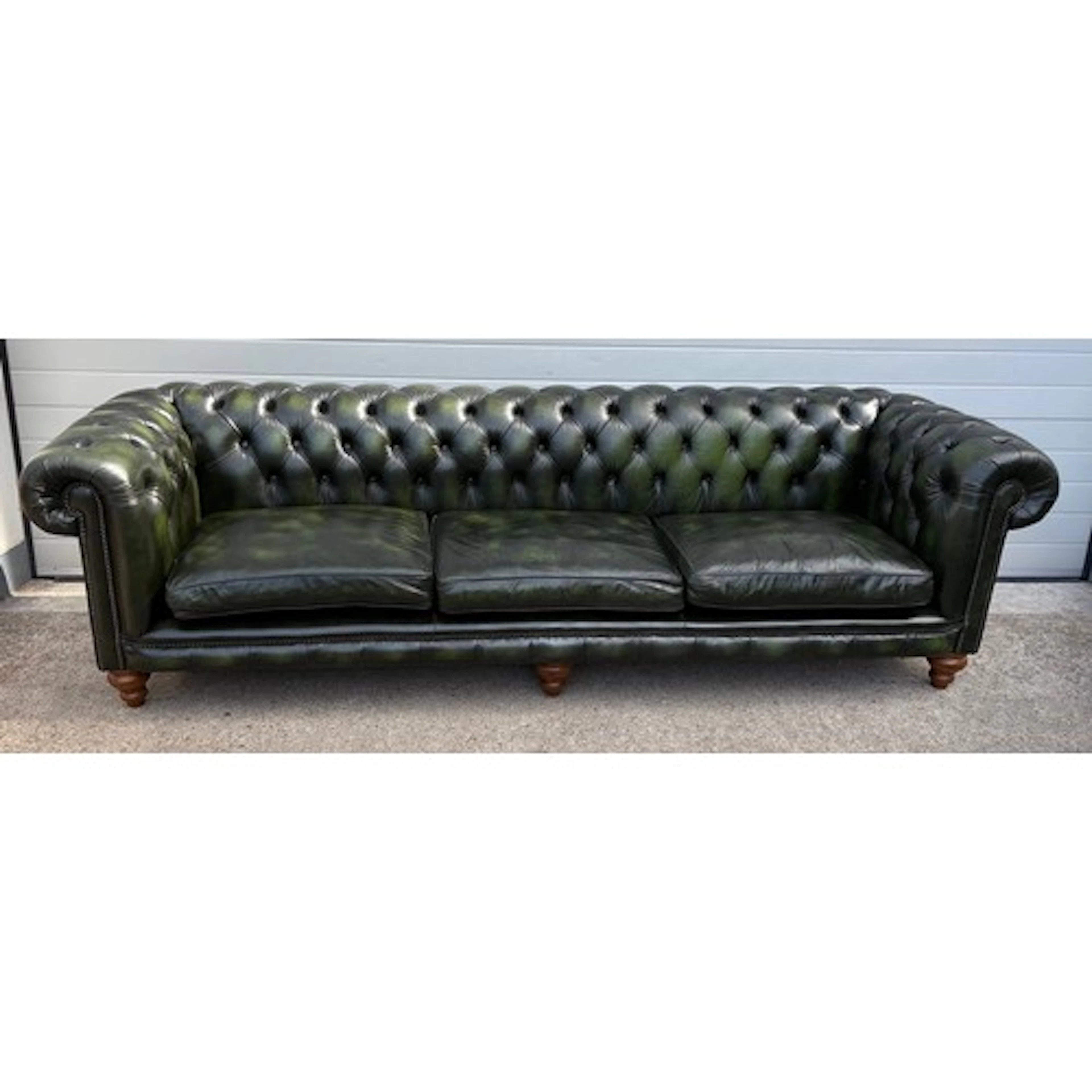 A large, oversized green leather Chesterfield sofa 270cm lon...