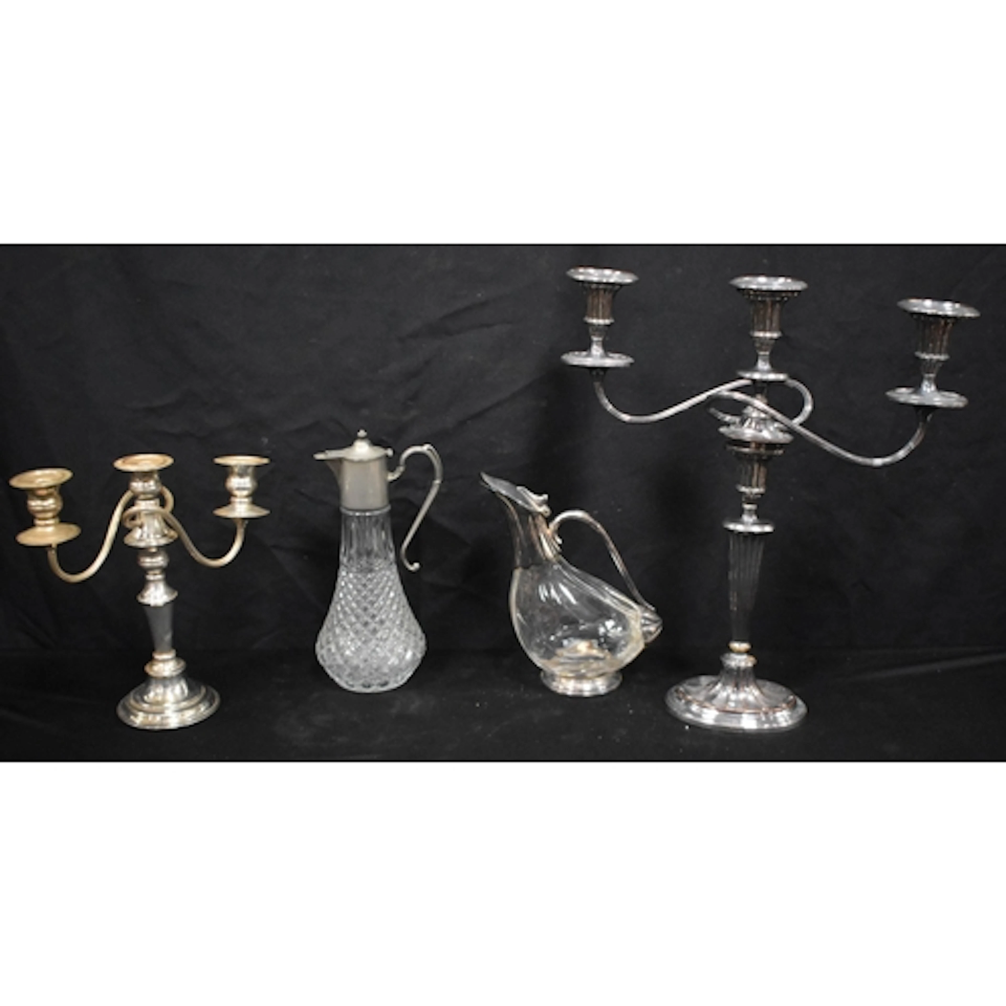 Two vintage silver plate candelabra together with a glass an...