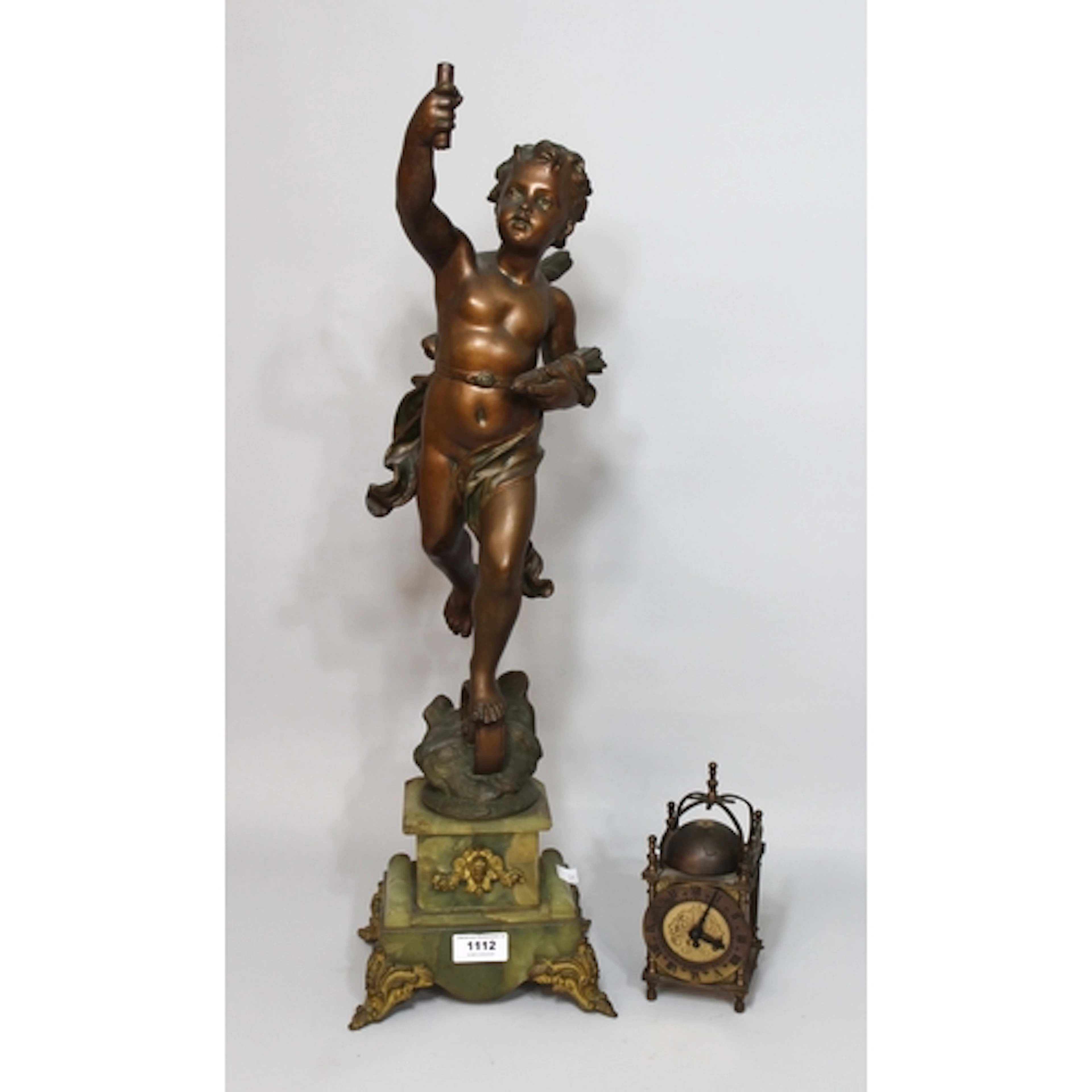 Spelter cherub figure on onyx base, together with a reproduc...