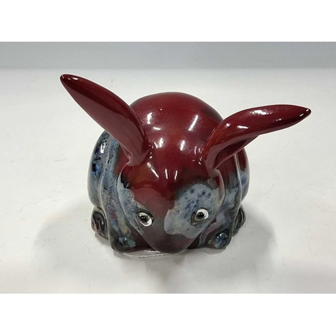 A BERNARD MOORE RABBIT FIGURE, the hollow figure of a seated...