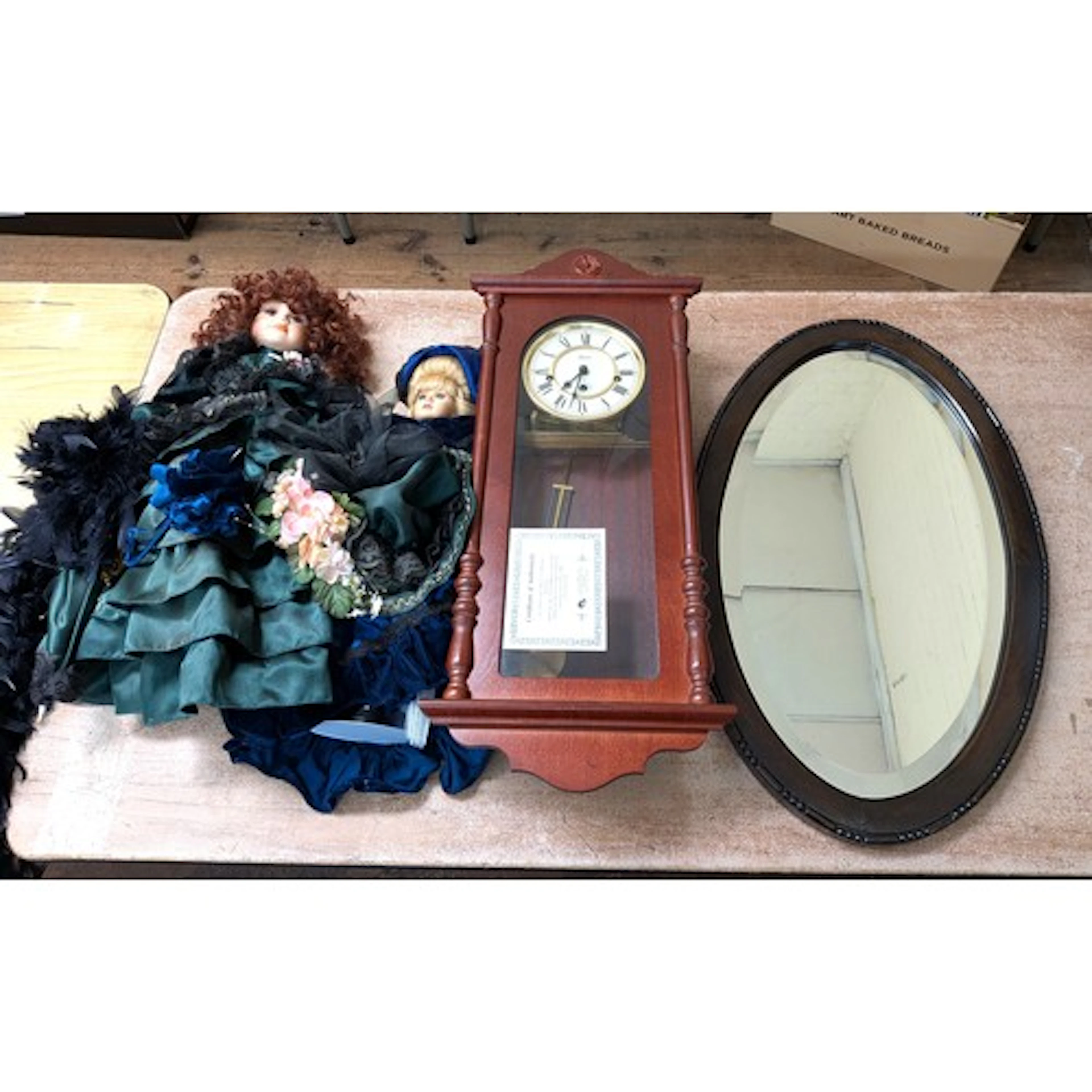 A modern mahogany drop dial wall clock together with a mahog...