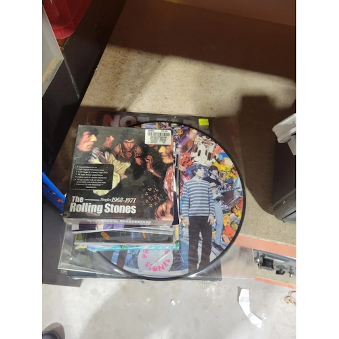 Two boxes containing a large quantity of Beatles hardback an...