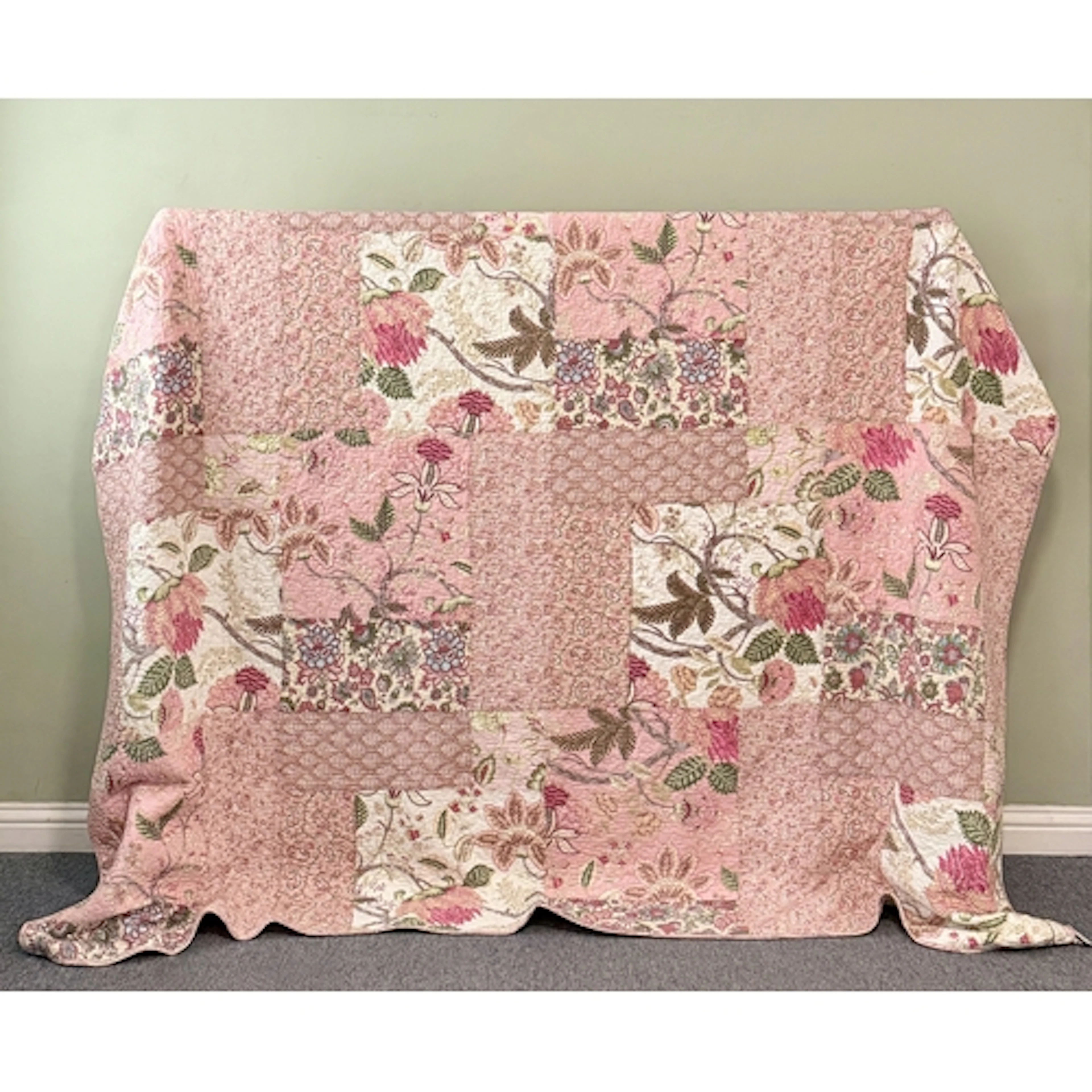A Forever England quilted bedspread - with a pink and green ...