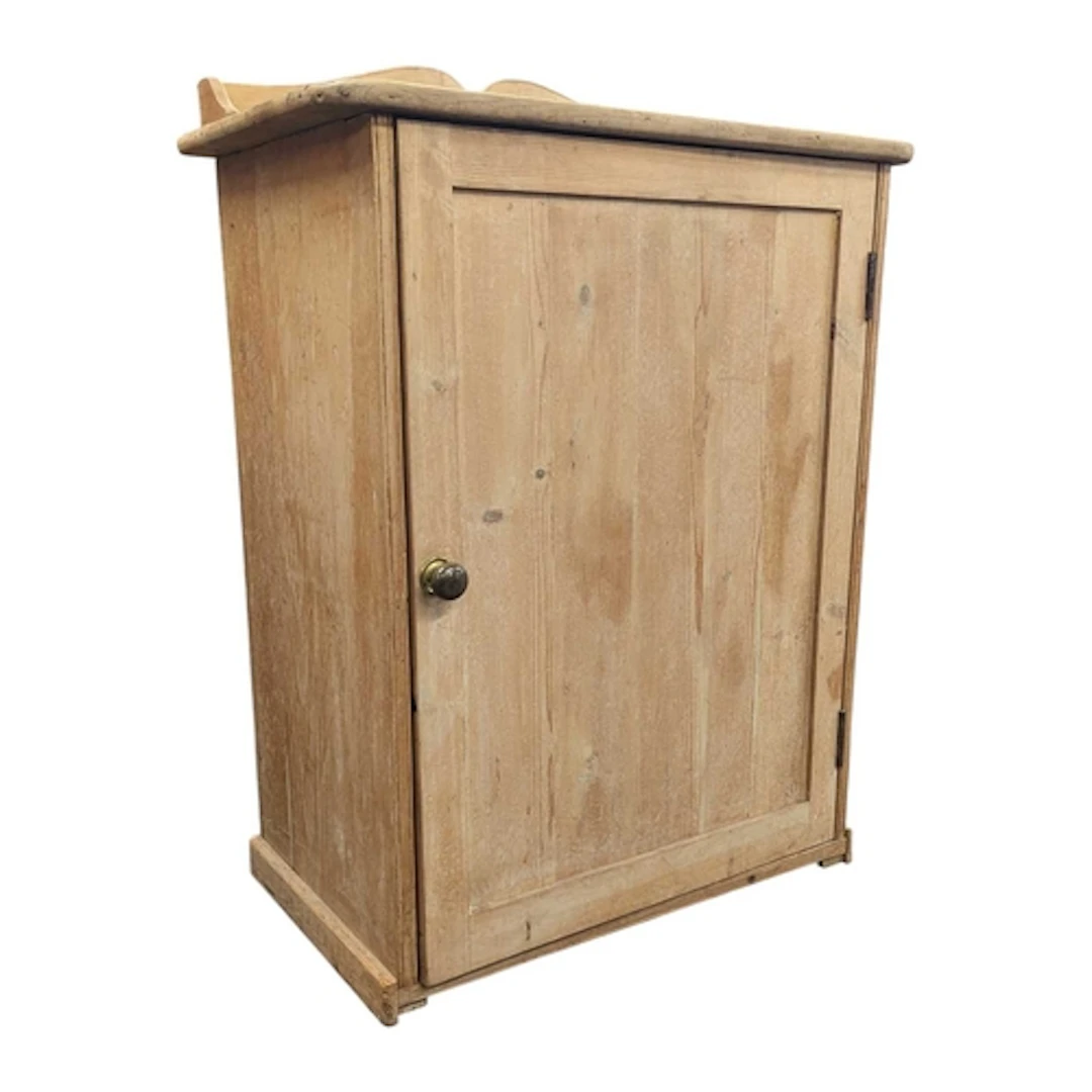A 19th century Victorian pine cupboard. The cabinet having s...