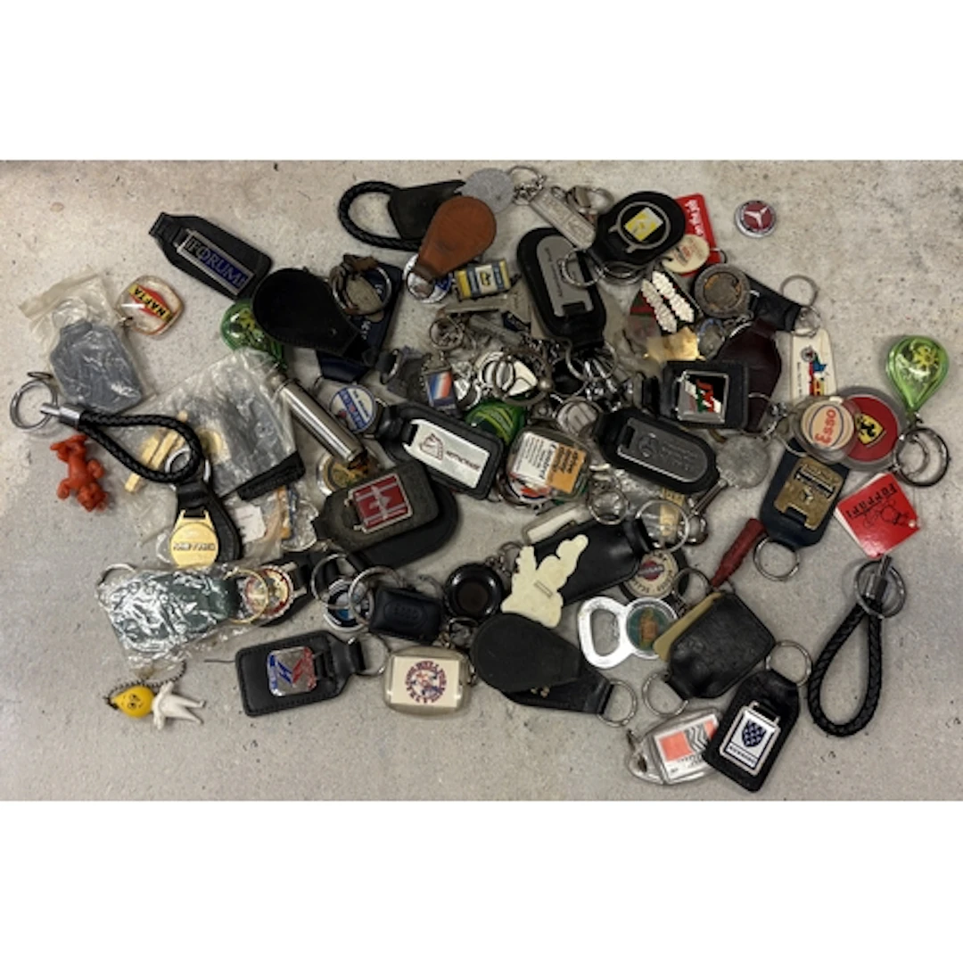 A collection of motoring related keyrings. Est. £20 - £30.