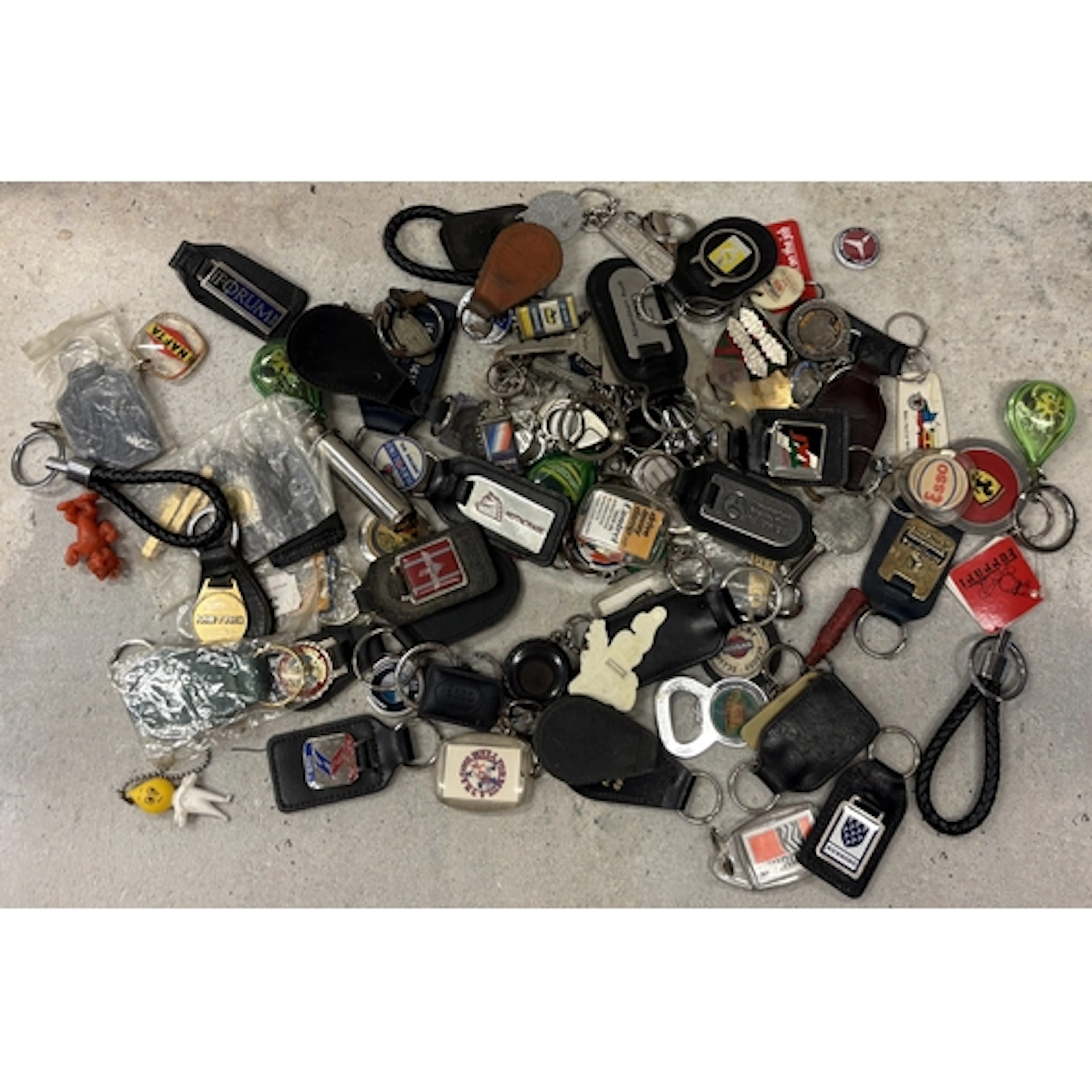 A collection of motoring related keyrings. Est. £20 - £30.