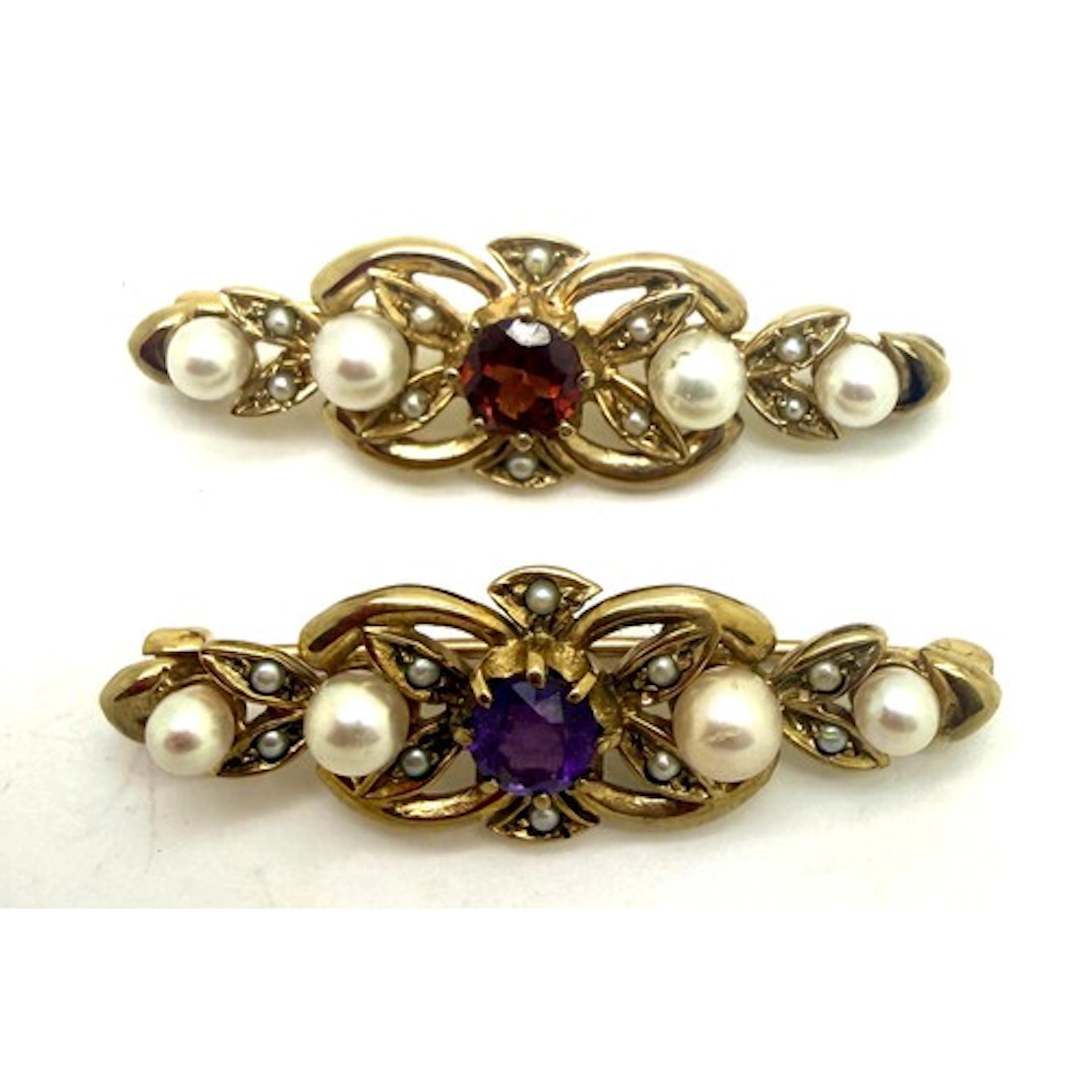 Two 9 carat gold bar brooches set with seed pearls and centr...