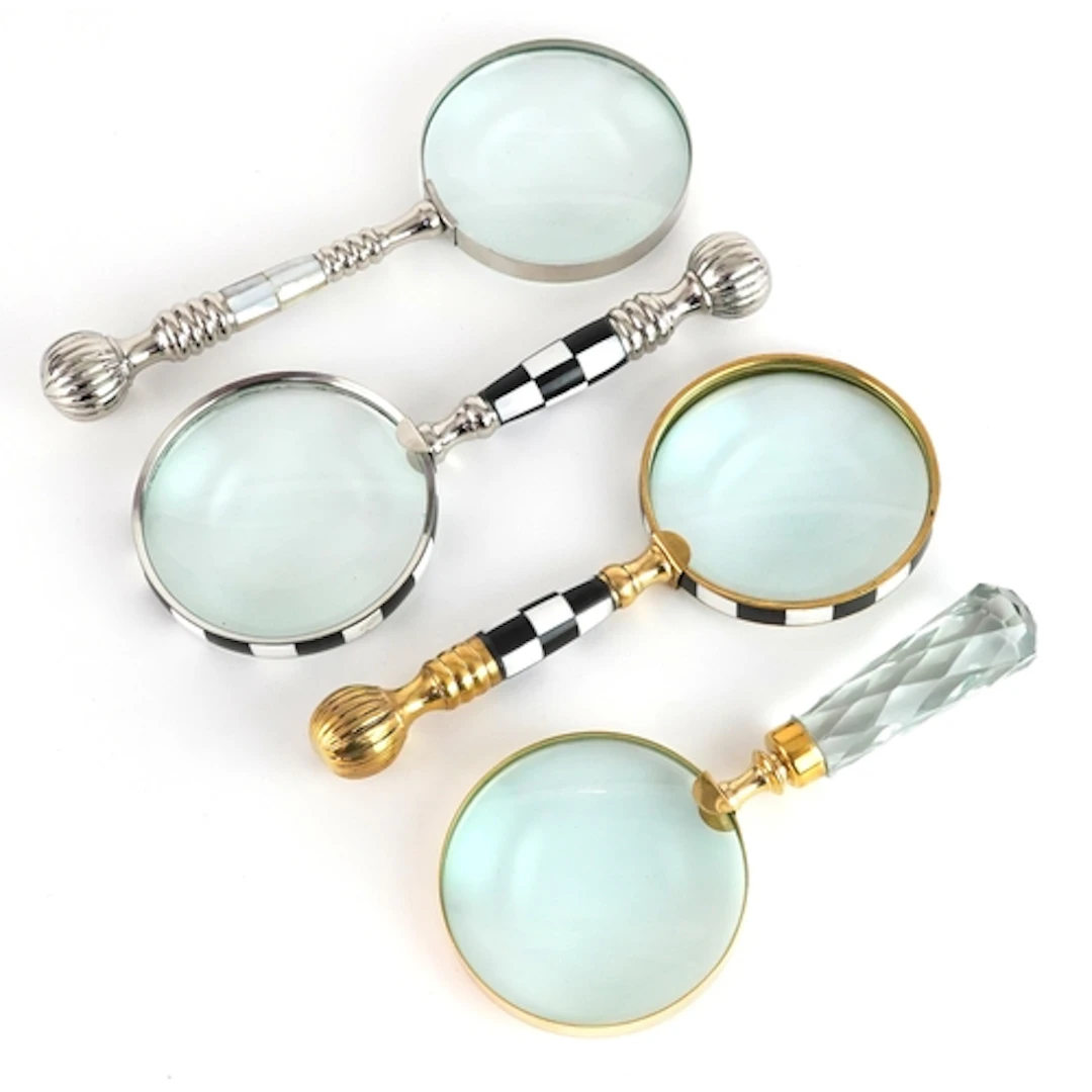 Four magnifying glasses including one with mother of pearl h...