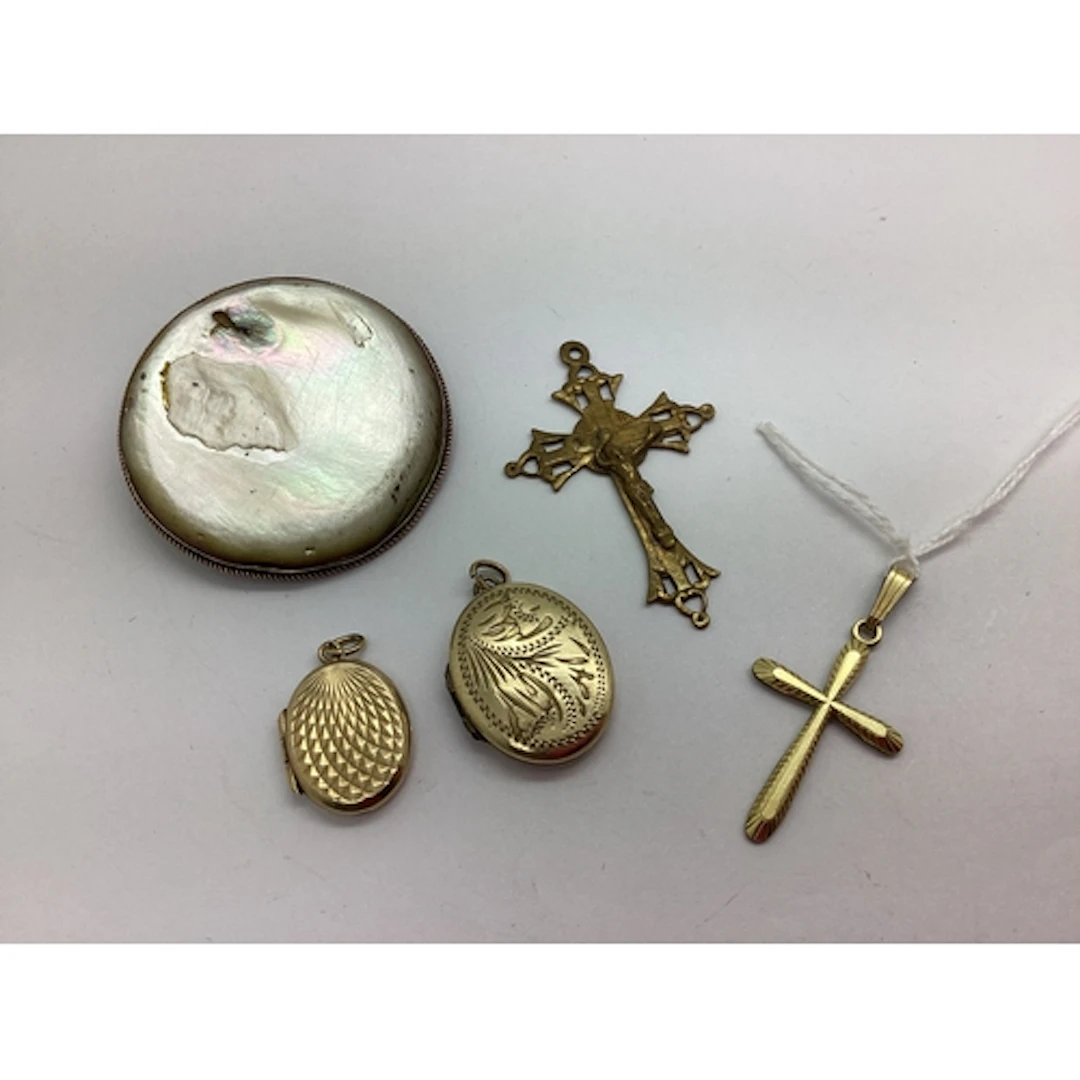 A Rolled Gold Oval Locket Pendant, engraved detail to the fr...