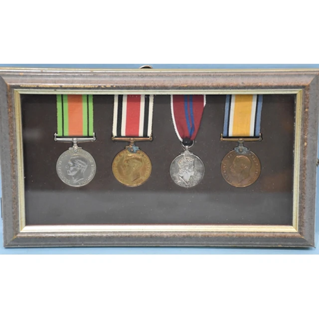 A collection of four medals, comprising: George V WWI Territ...