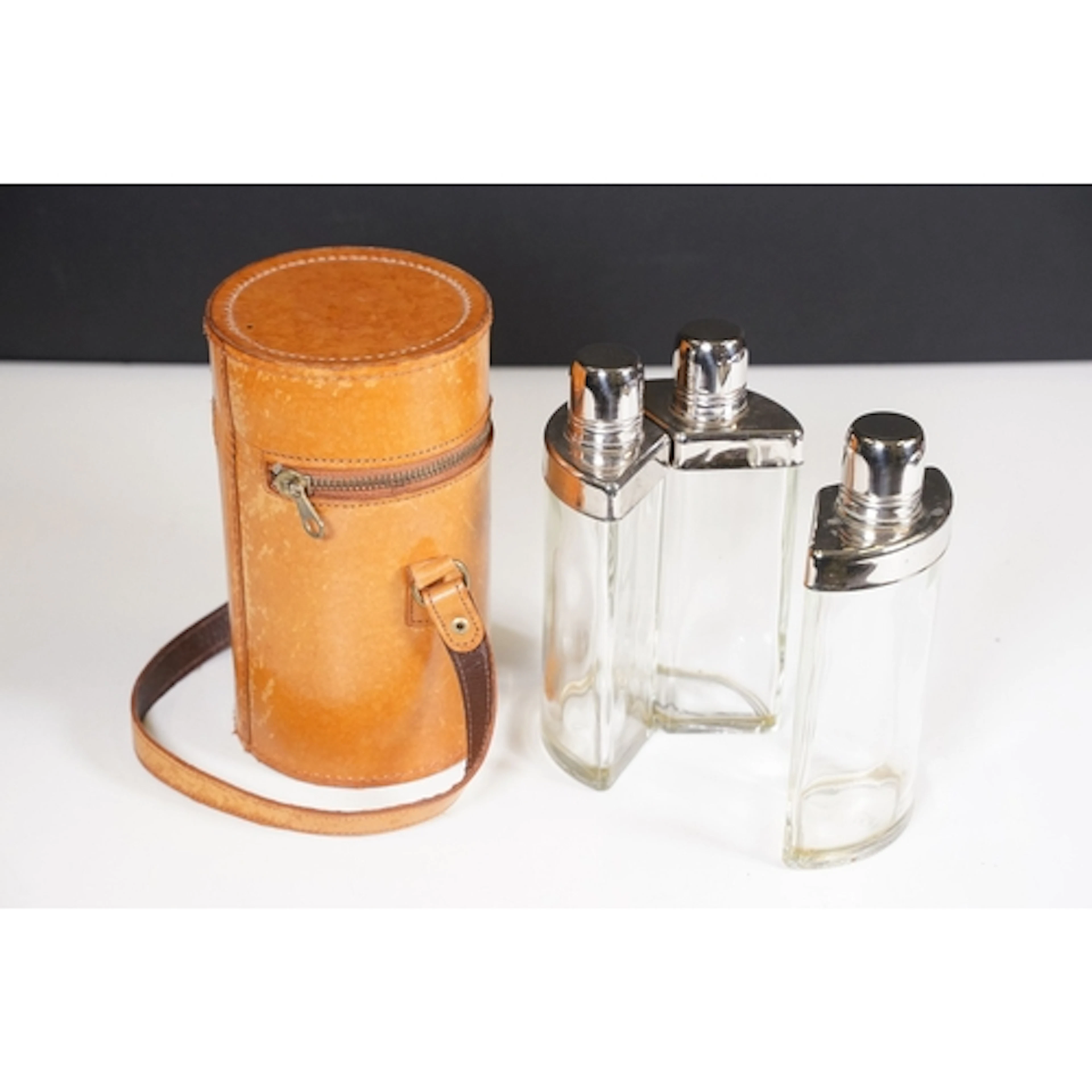 Ford motor cars brown leather cylindrical case holding three...