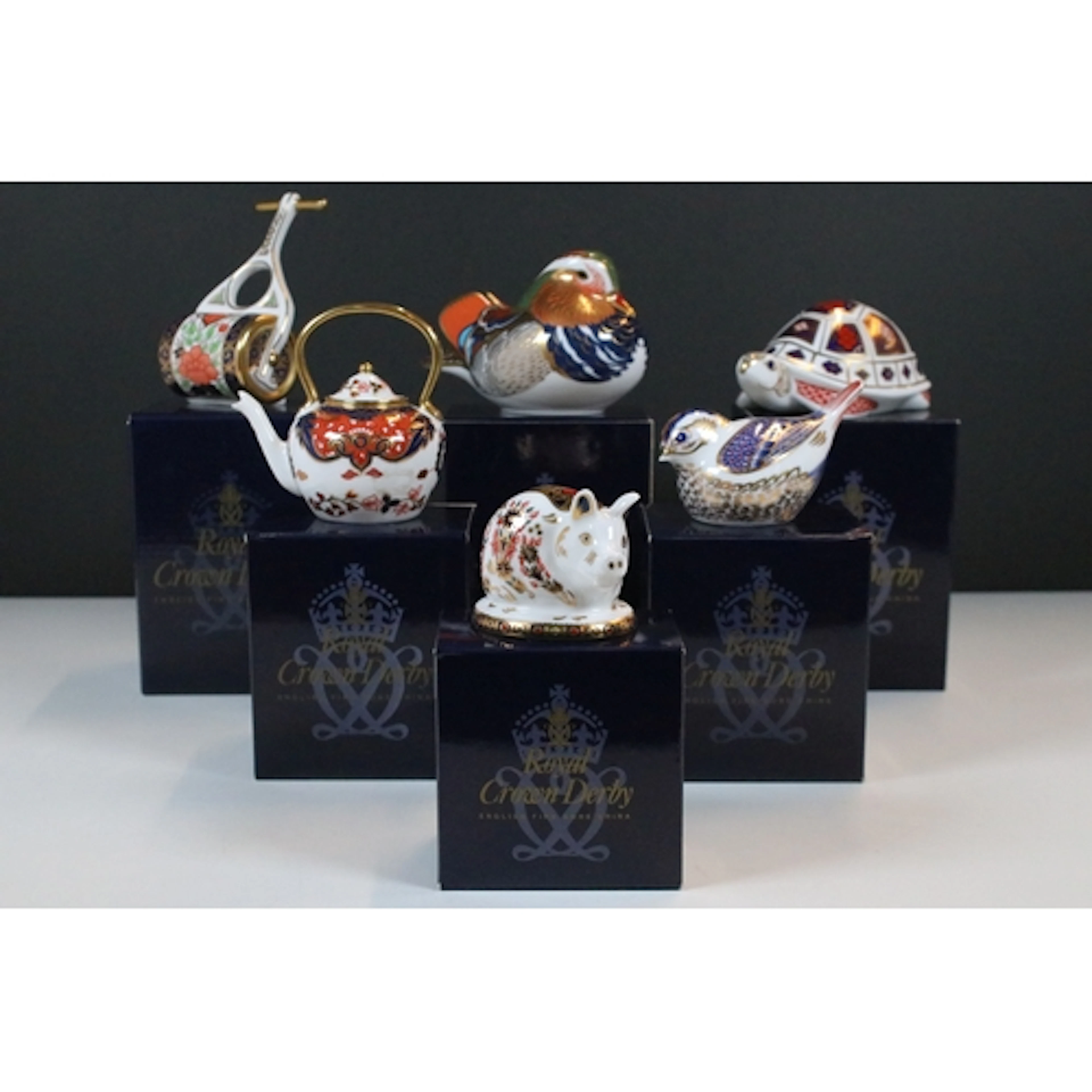 Collection of Royal Crown Derby, comprising: four paperweigh...