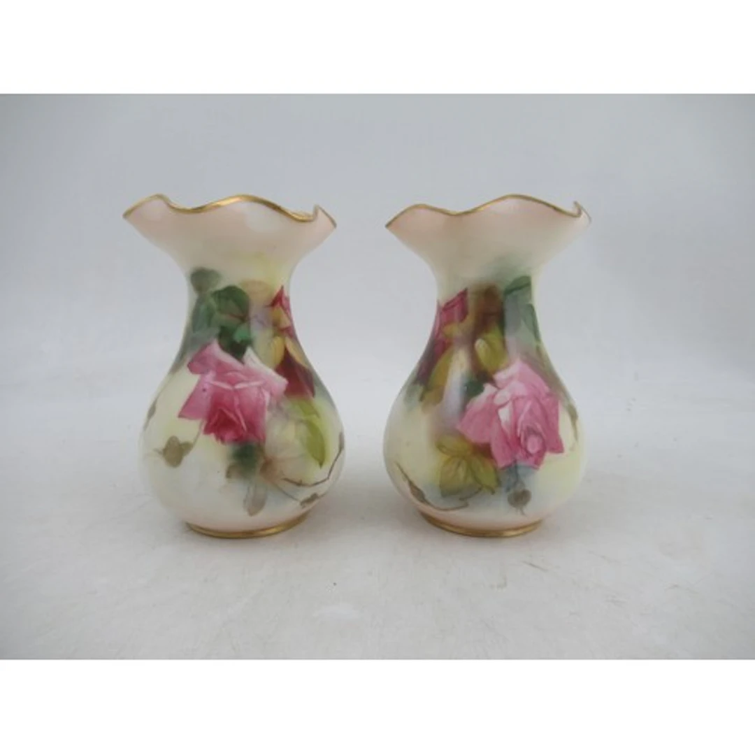 Two Royal Worcester club shaped vases, decorated with roses,...