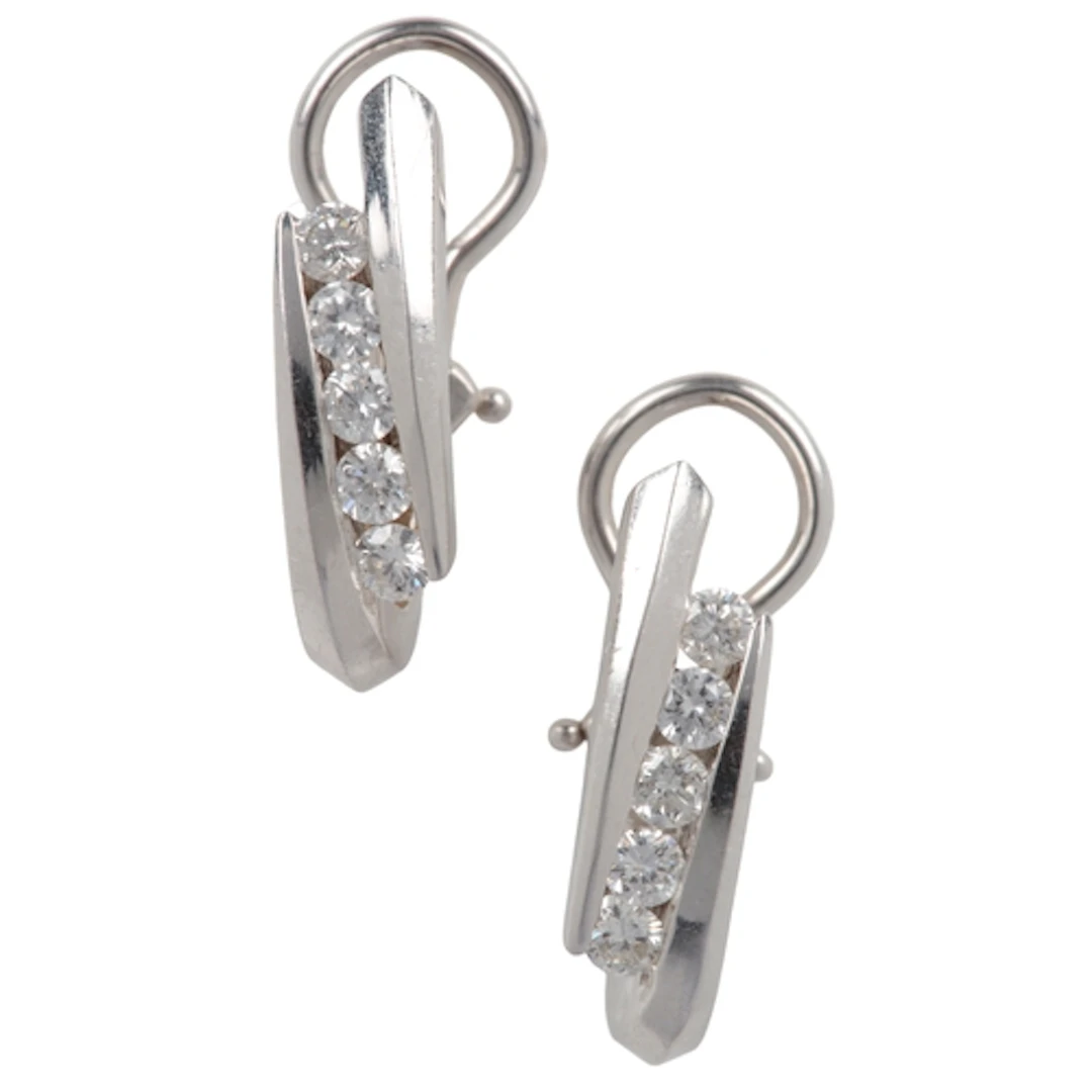 A pair of diamond earrings, channel-set with lines of brilli...