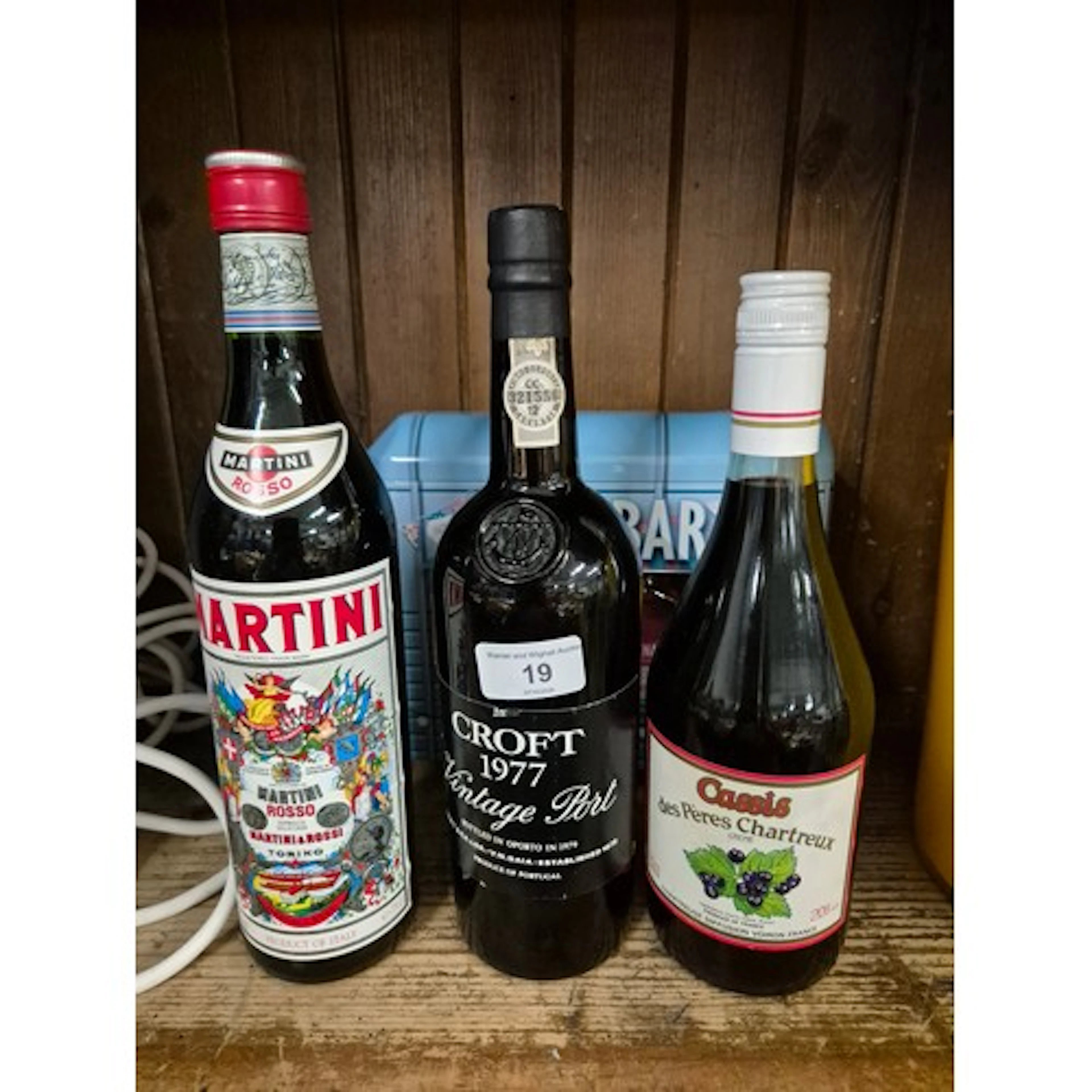A bottle of Croft port, 1977 vintage, a bottle of cassis, a ...